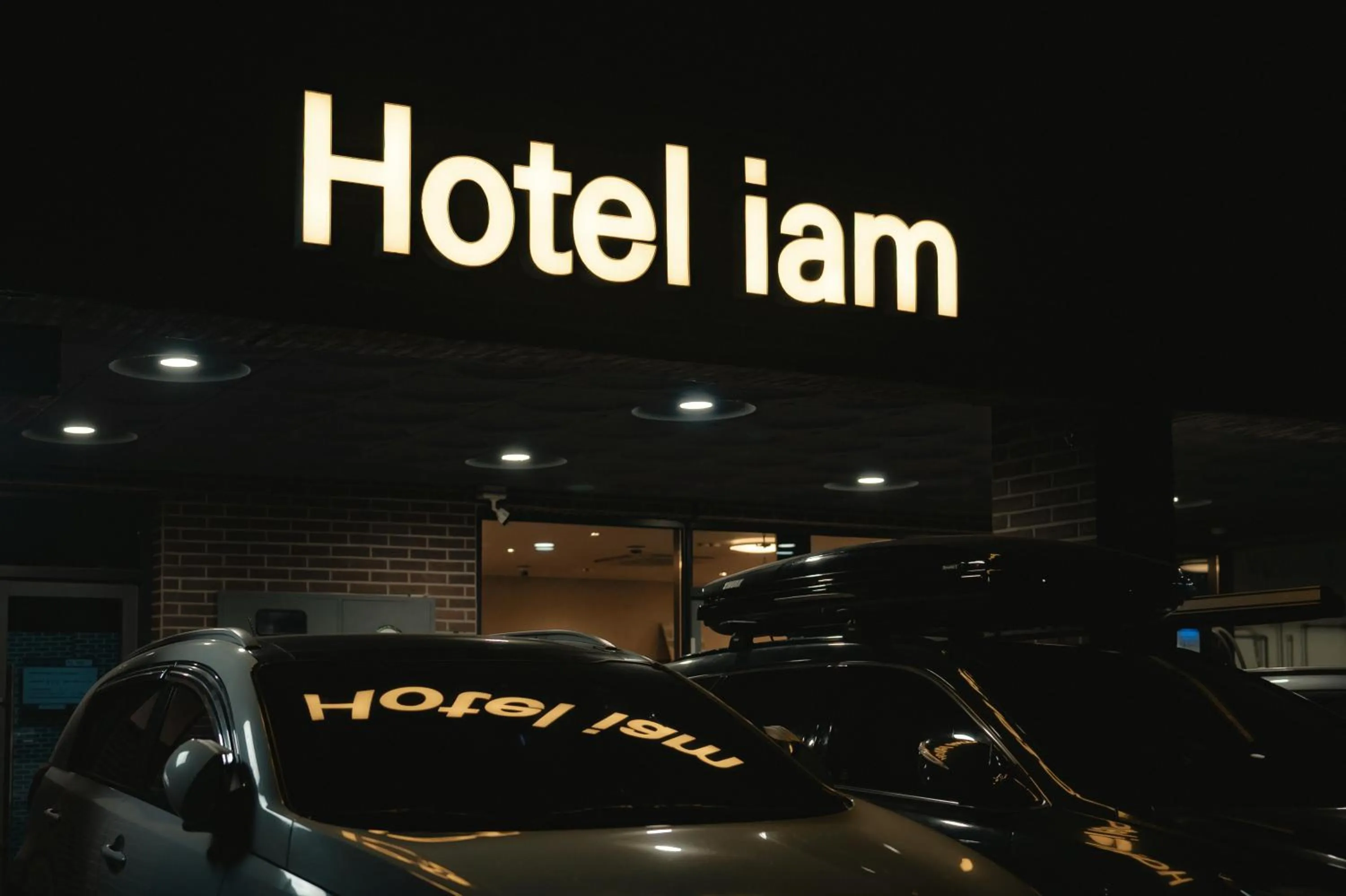 Property logo or sign in Hotel Iam