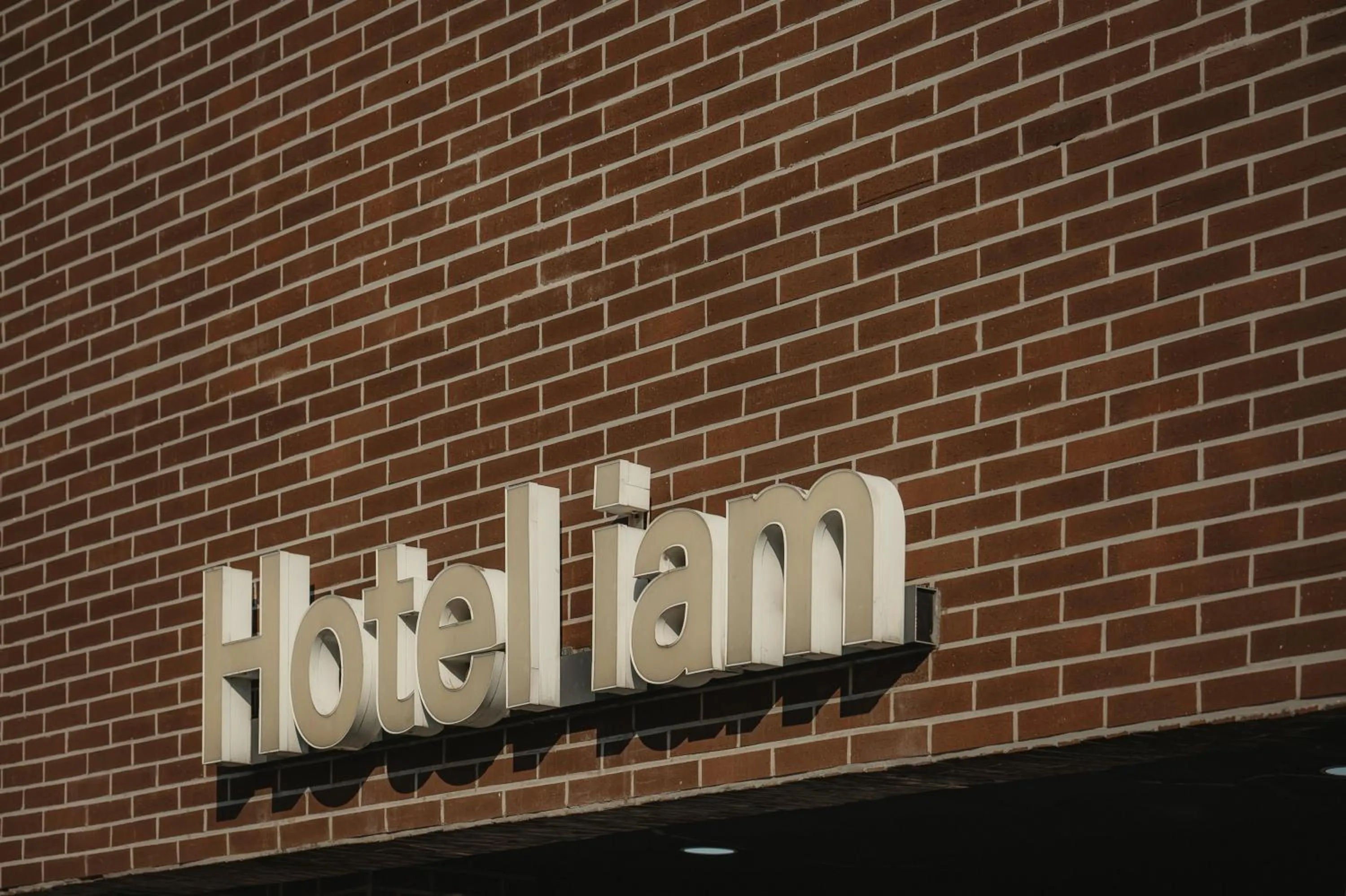 Property logo or sign in Hotel Iam