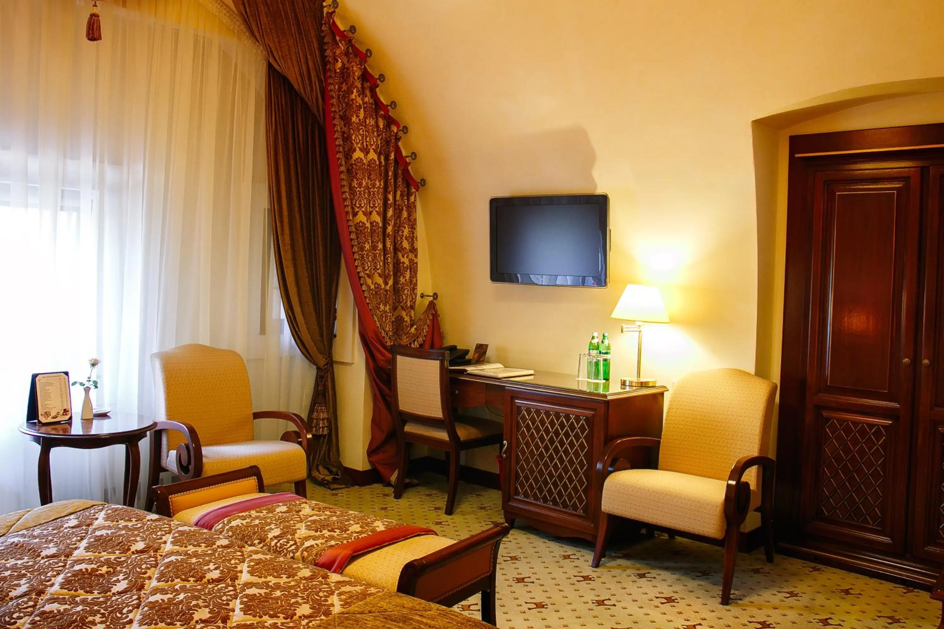 Seating area, Bed in Citadel Inn Gastro Boutique Hotel - Готель Цитадель Львів