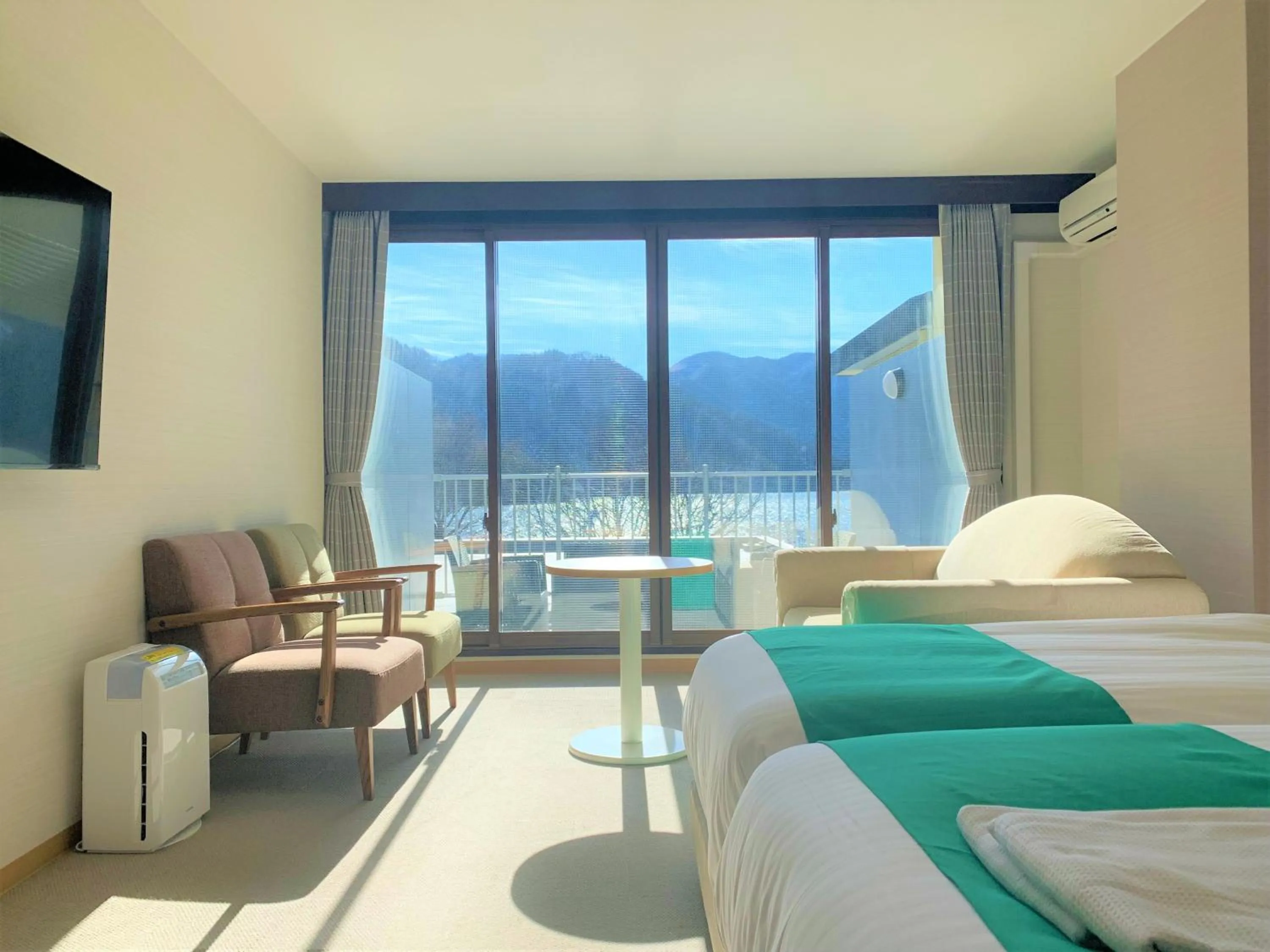 Communal lounge/ TV room, Bed in Hatago Nagomi