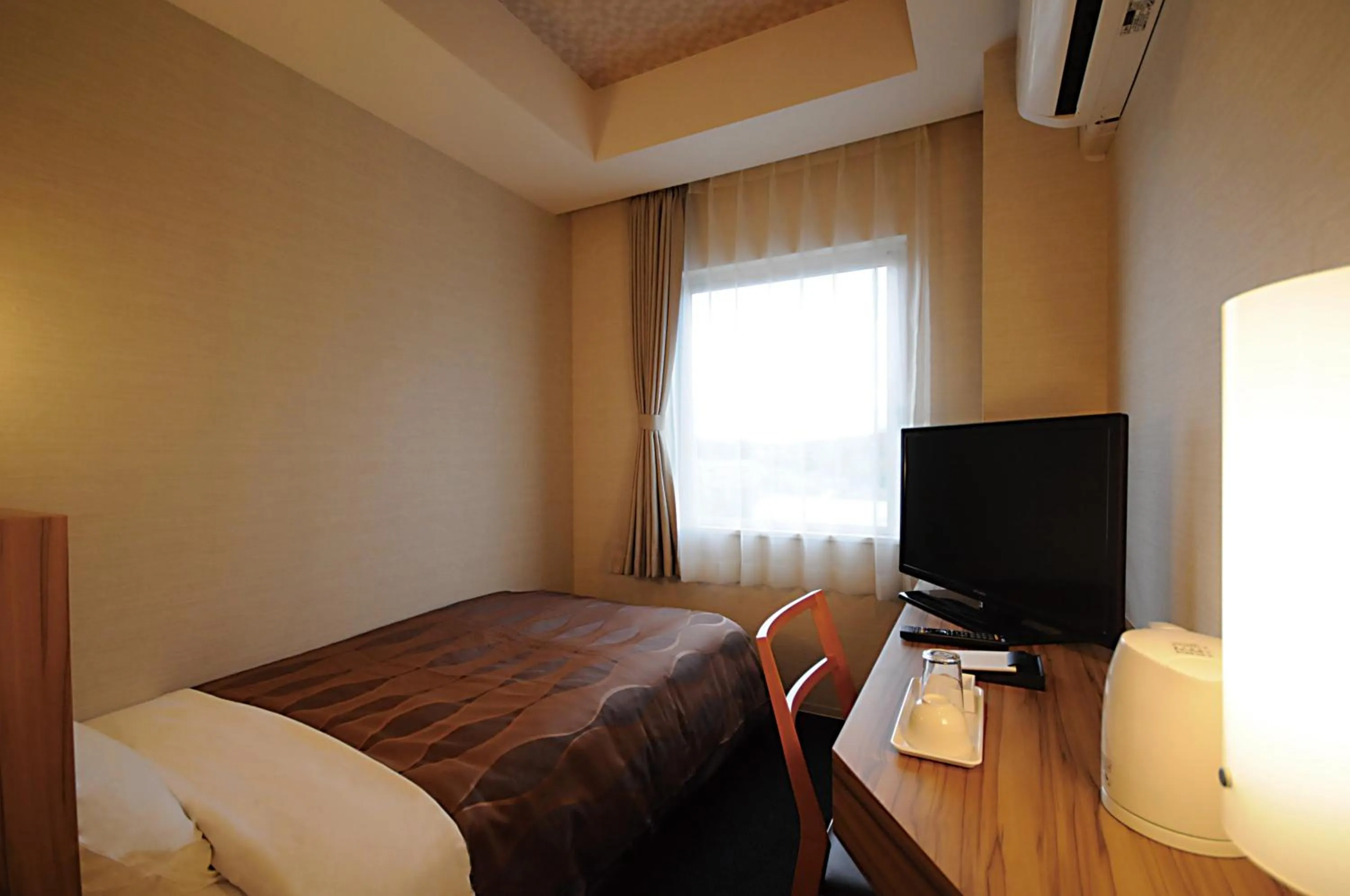 Bed in Hotel Lexton Tanegashima