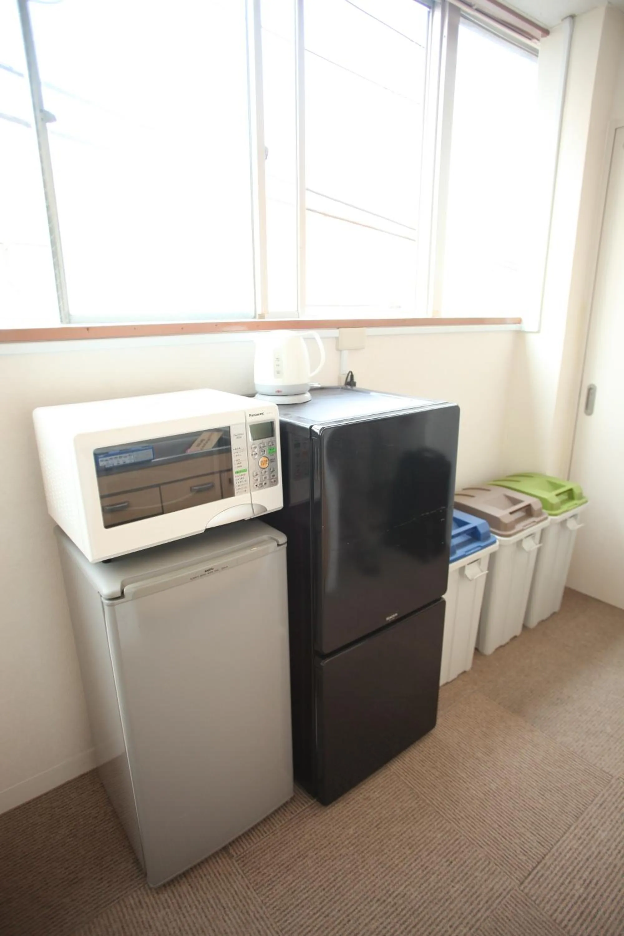 Kitchen or kitchenette in Base Inn Tabata