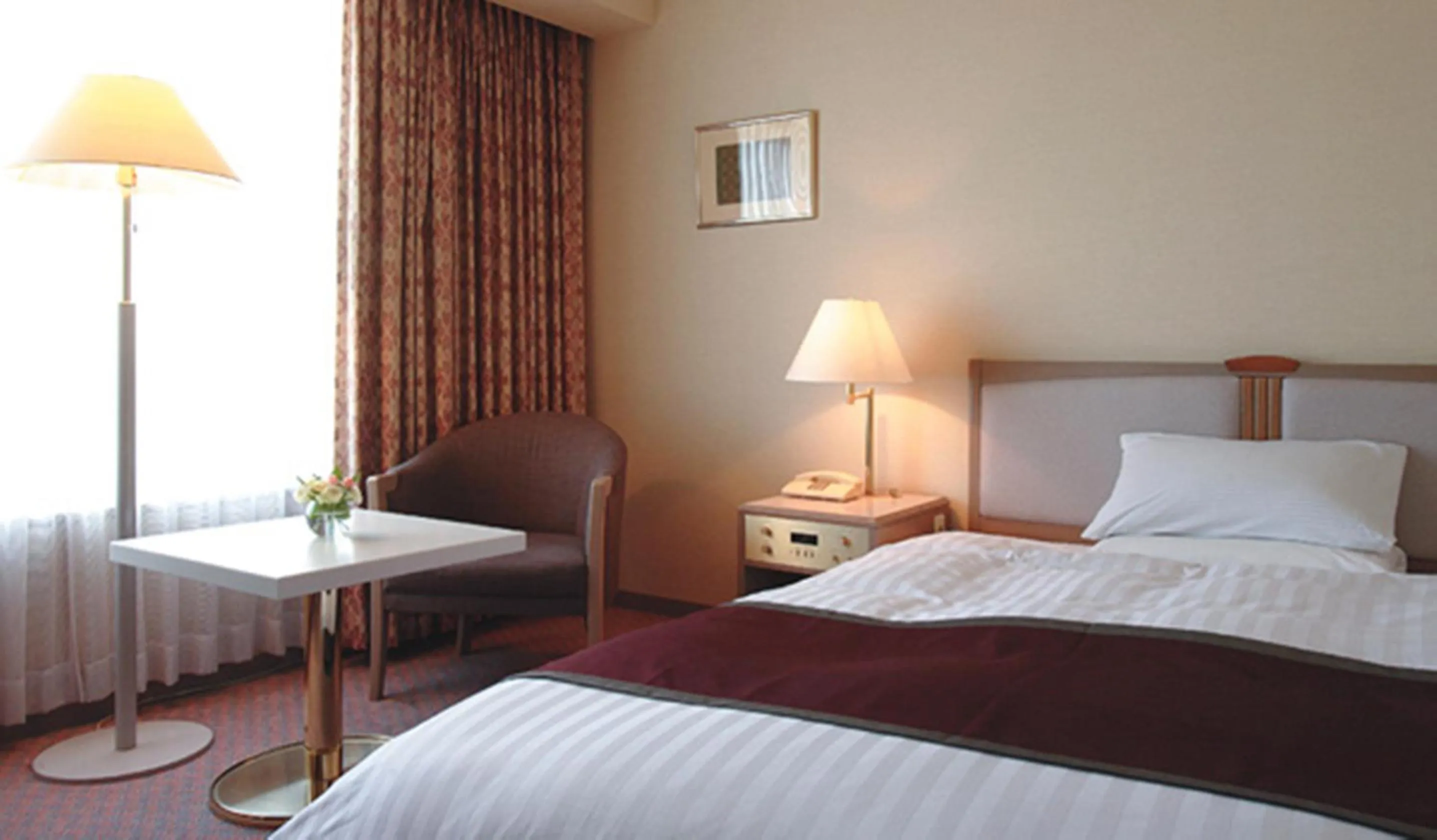 Photo of the whole room, Bed in Miyako Hotel Yokkaichi