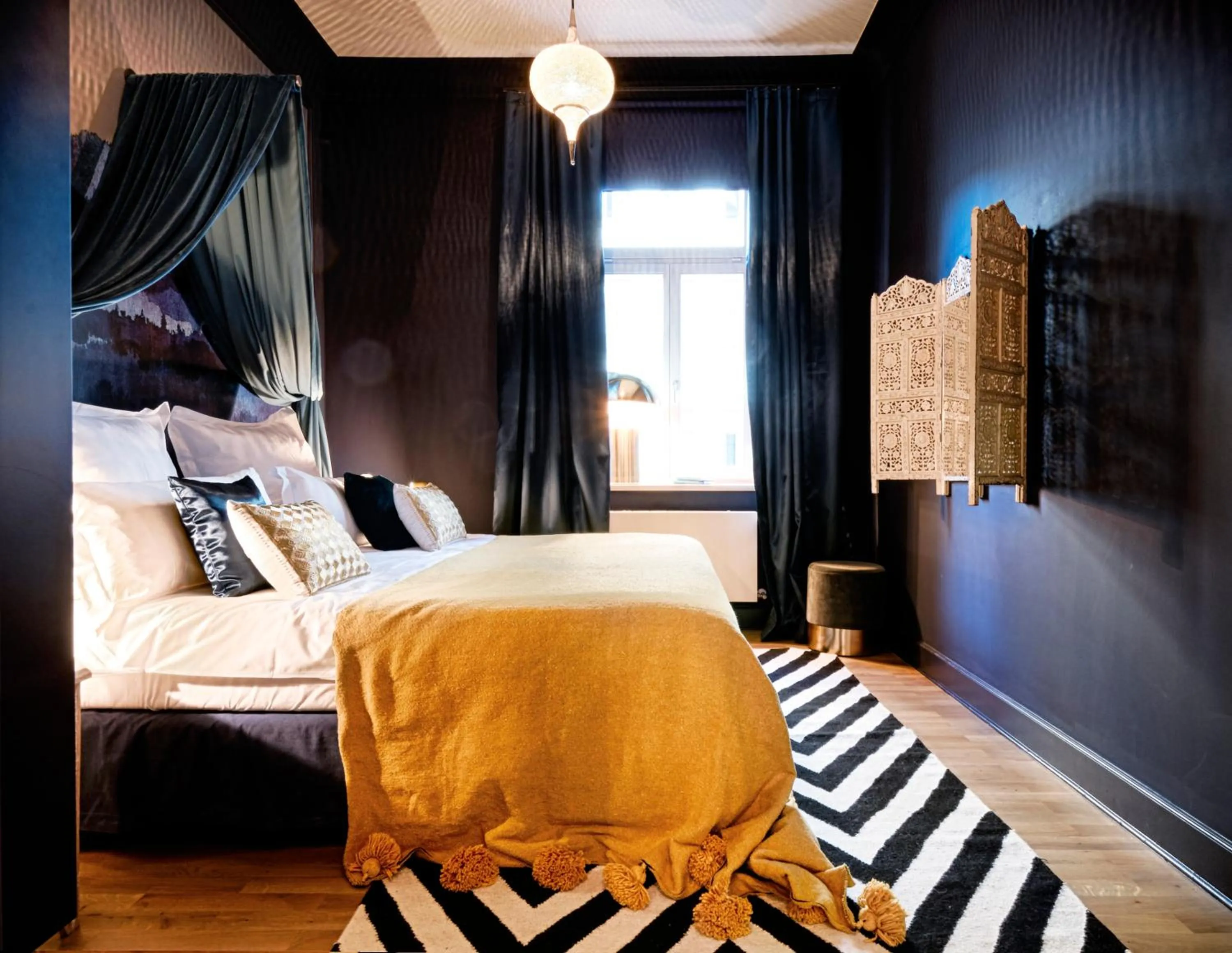 Decorative detail, Bed in Cora Apartments