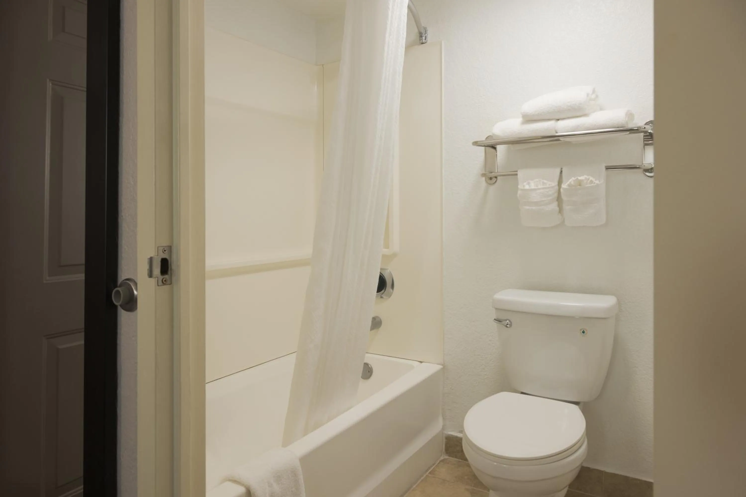 Toilet in The Palms Inn & Suites Miami, Kendall, FL