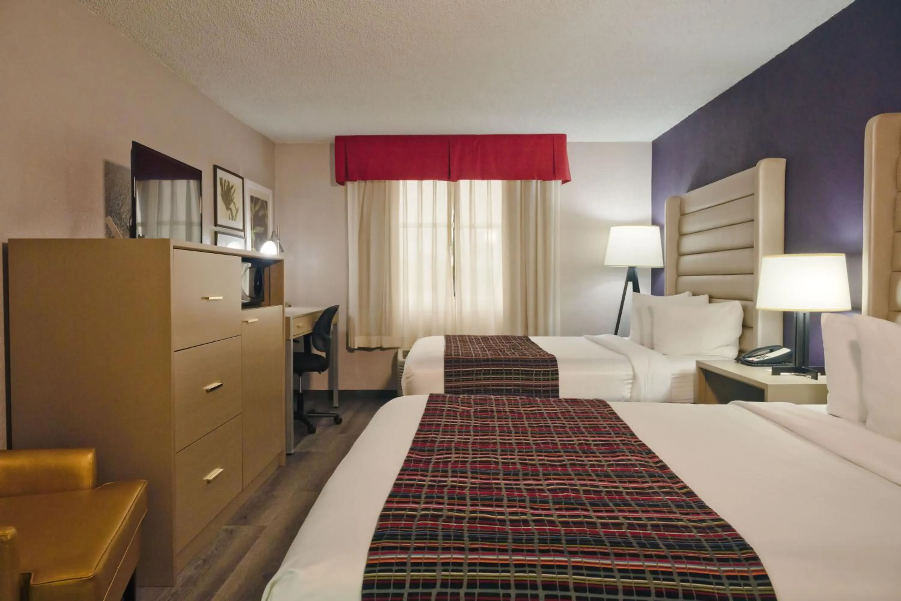 Bedroom, Bed in The Palms Inn & Suites Miami, Kendall, FL