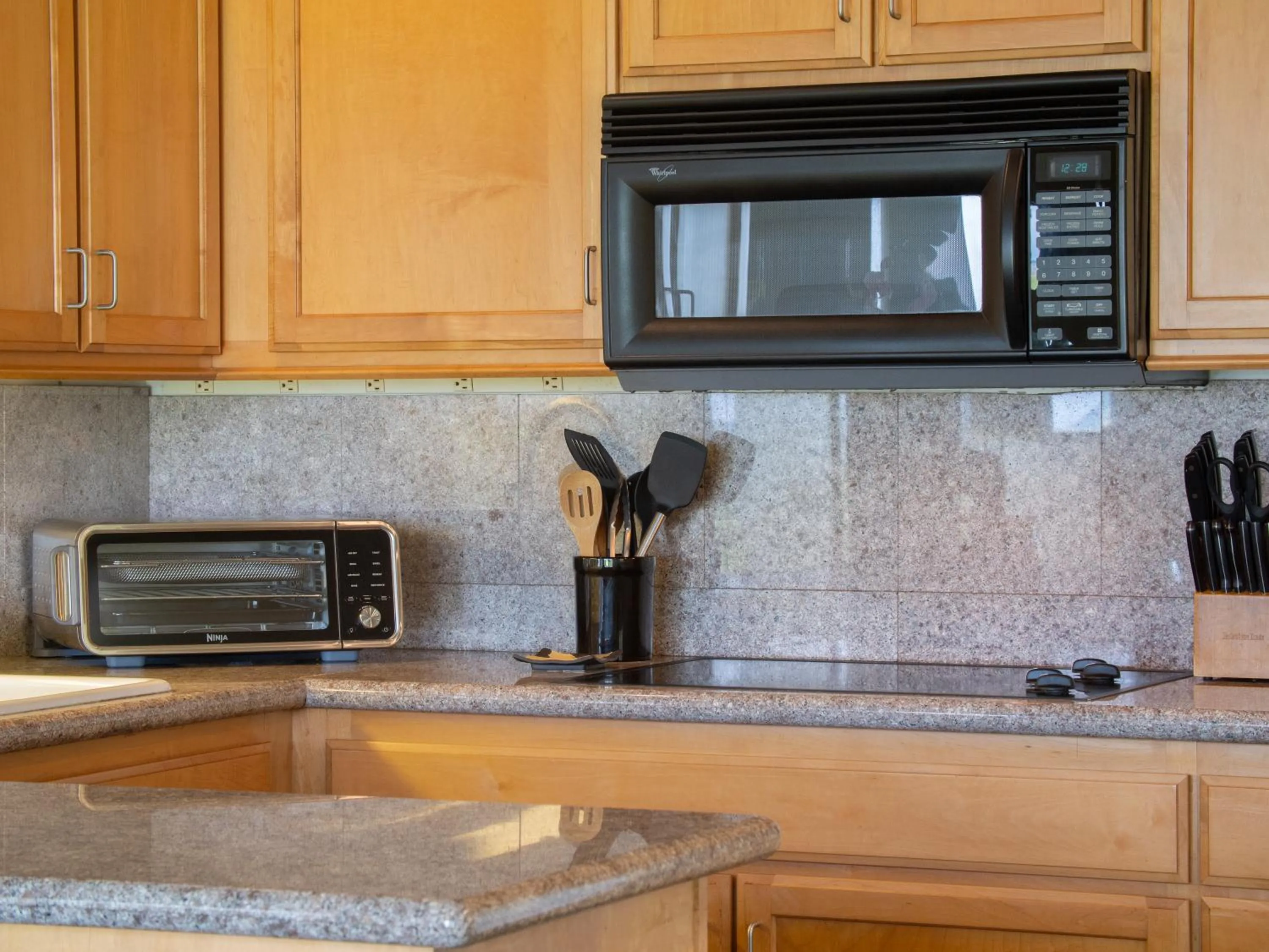 Kitchen or kitchenette in Aloha Aku Hula2 Suite - Experience Beachfront Bliss