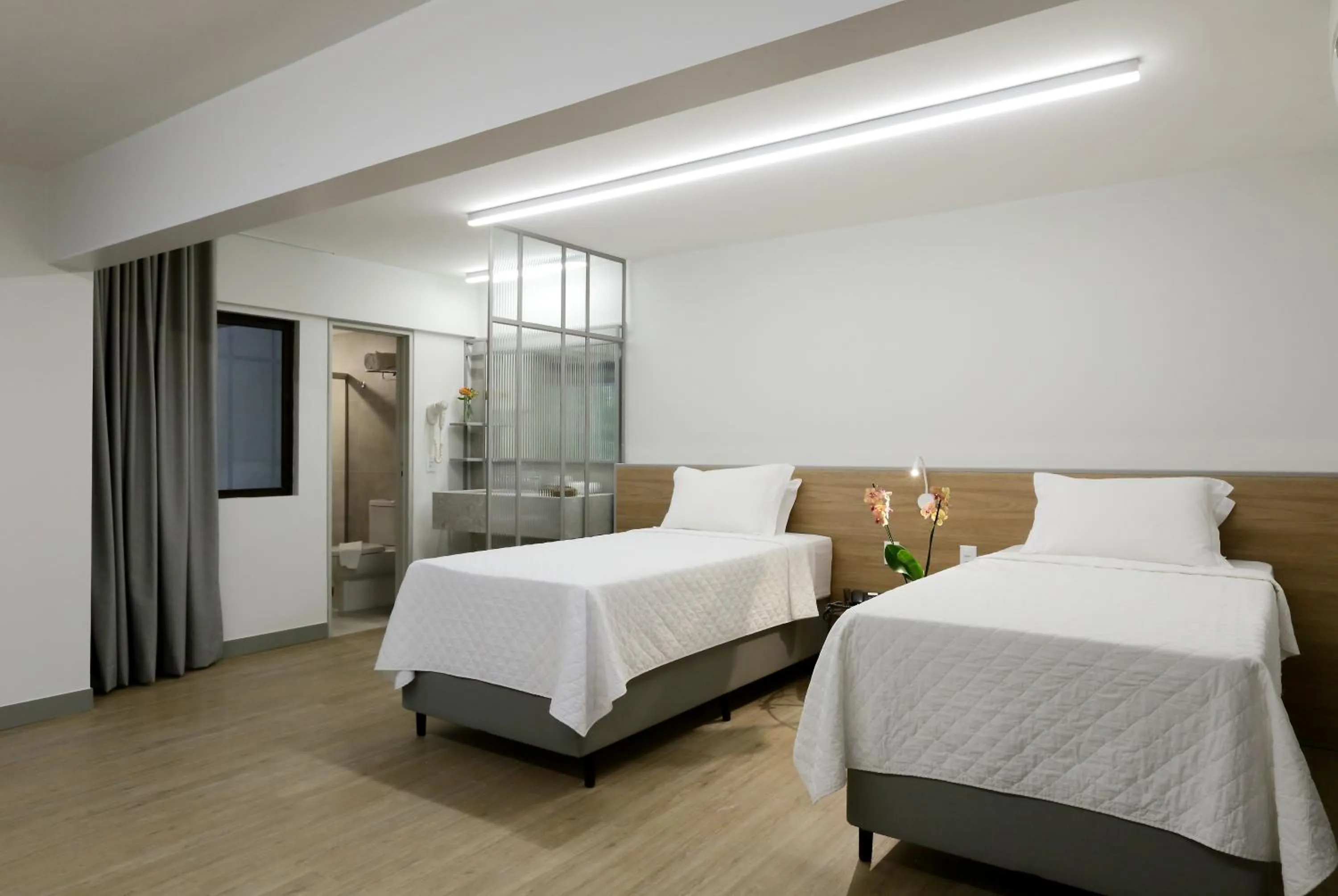 Bed in San Marino Suite Hotel