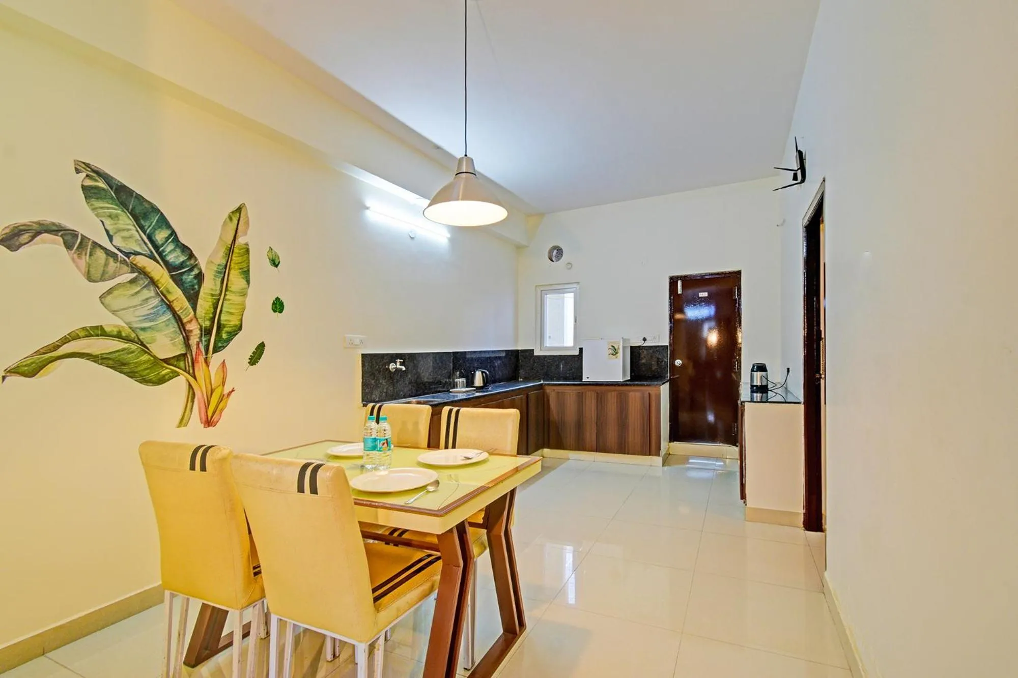 Kitchen or kitchenette in FabHotel Namaha Suites - Nr Hyderabad International Airport, Shamshabad