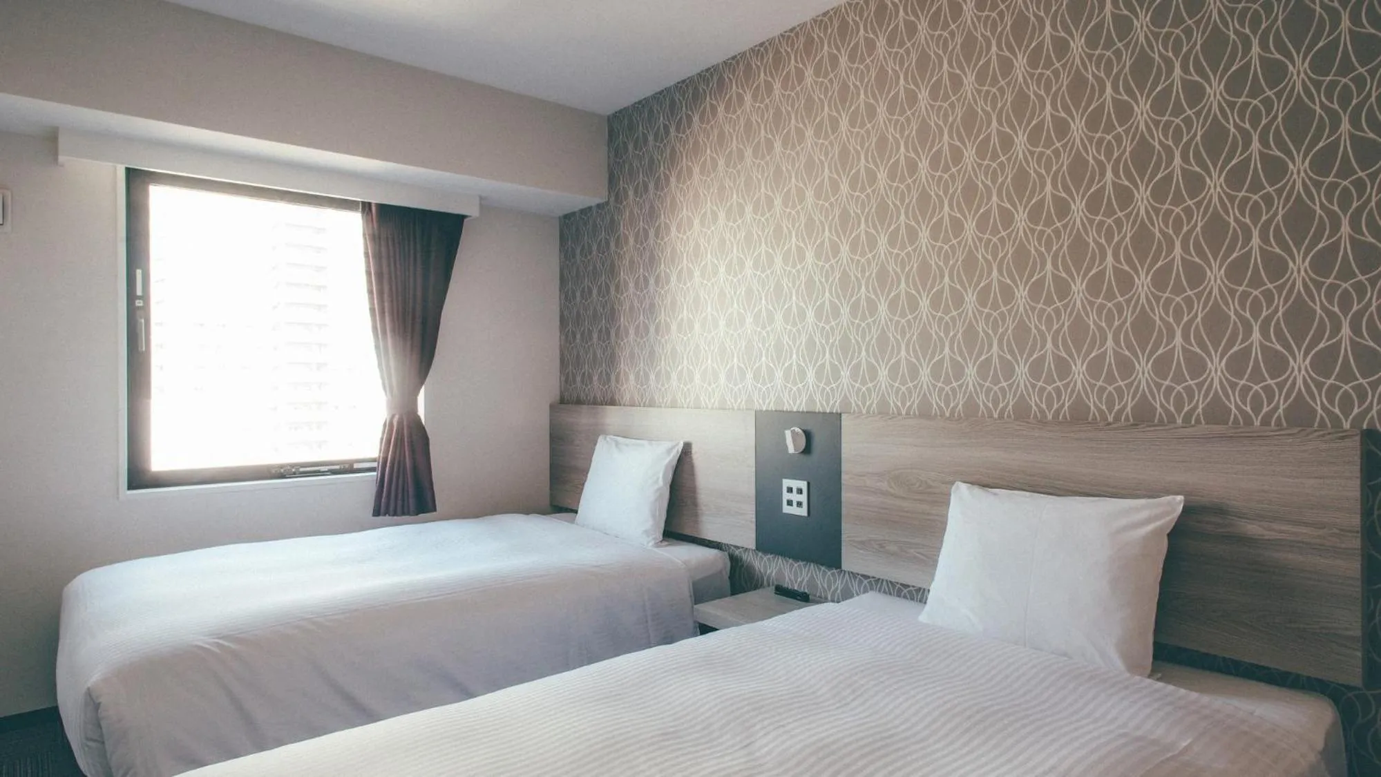 Bed in Kuretake Inn Premium Nagoya Nayabashi