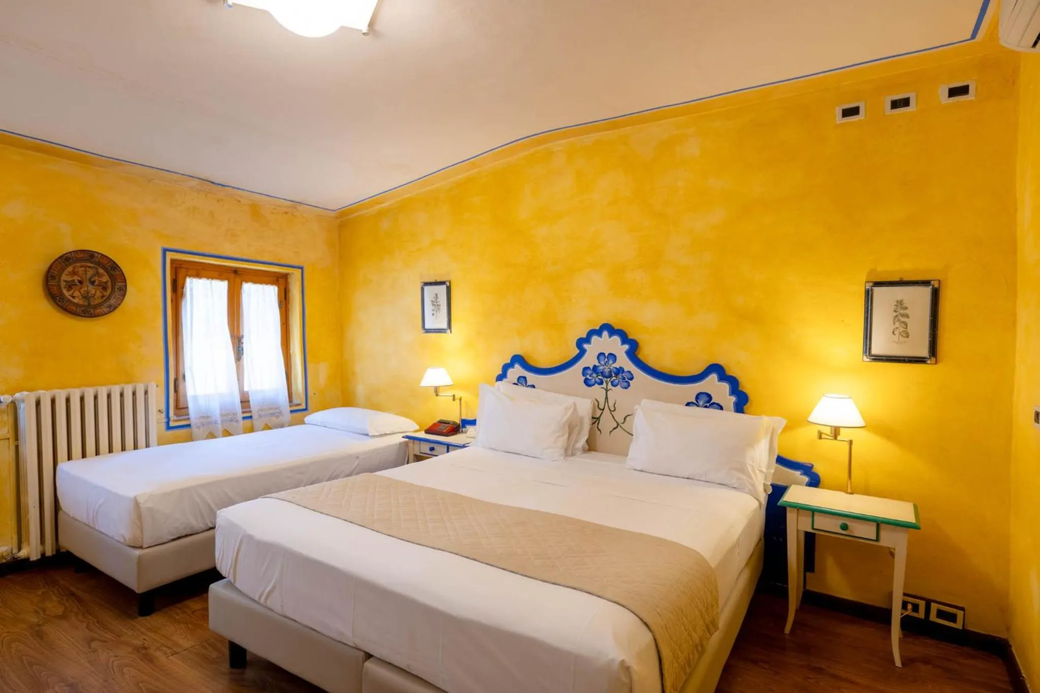 Bed in Quattro Gigli Hotel