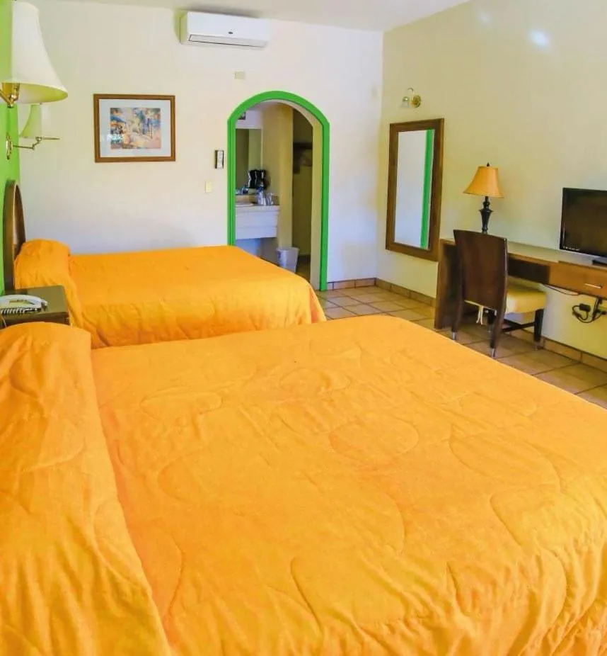 Bed in Hacienda Suites Loreto