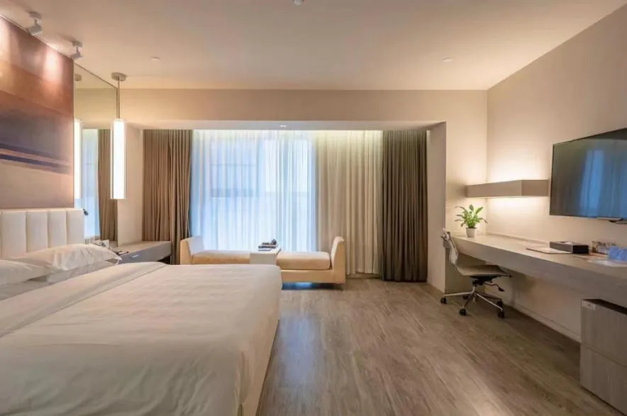 Bed in Jinjiang Metropolo Hotel Hangzhou East Railway Station