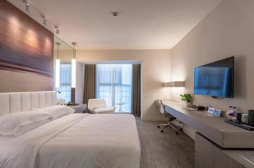 Bed in Jinjiang Metropolo Hotel Hangzhou East Railway Station