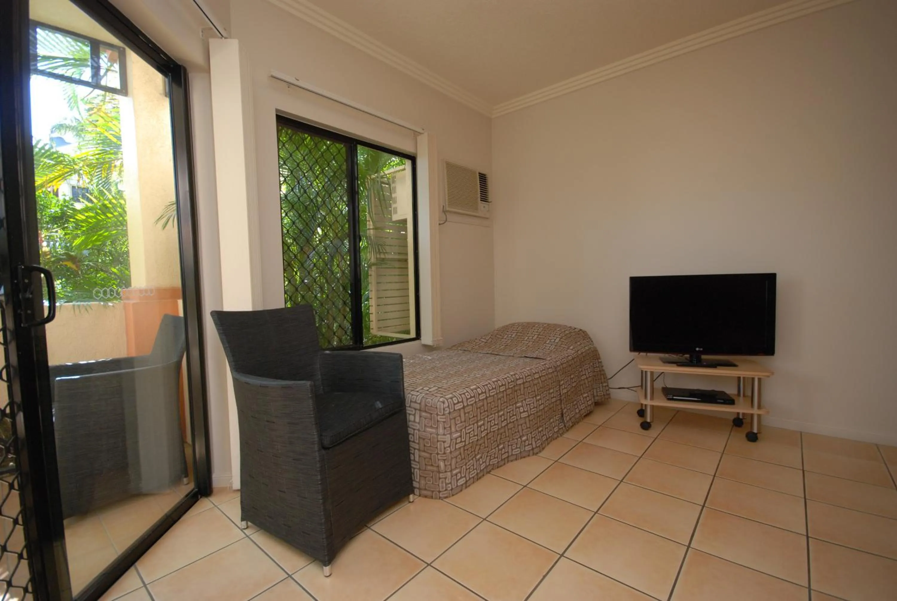 Bed in City Plaza Apartments