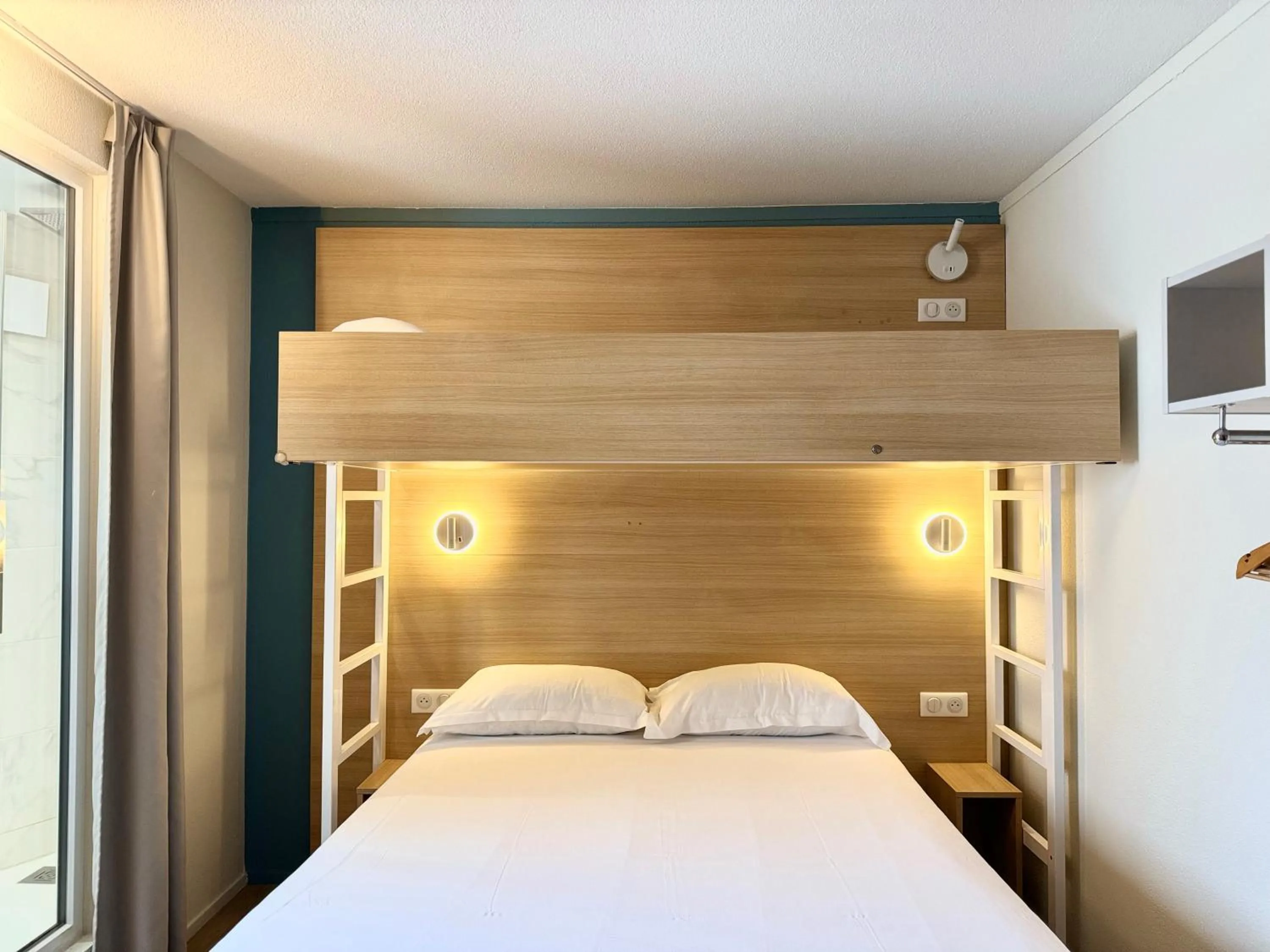 Bed in Kyriad DIRECT Saint Brieuc - Parc des Expositions