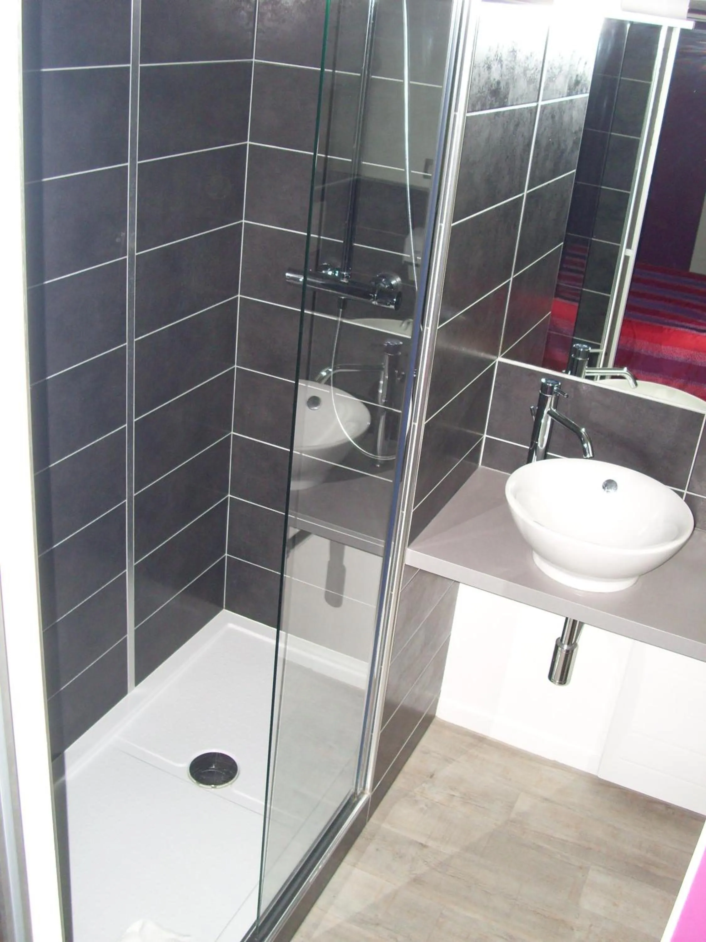 Shower in Hôtel Restaurant Du Parc de la Colombière