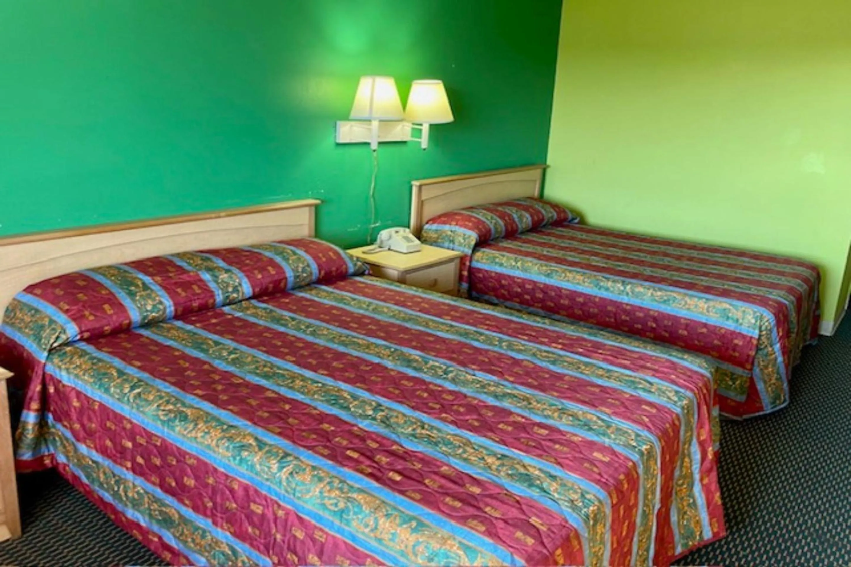 Bedroom, Bed in Red Carpet Inn & Suites Lima -Listing Partner