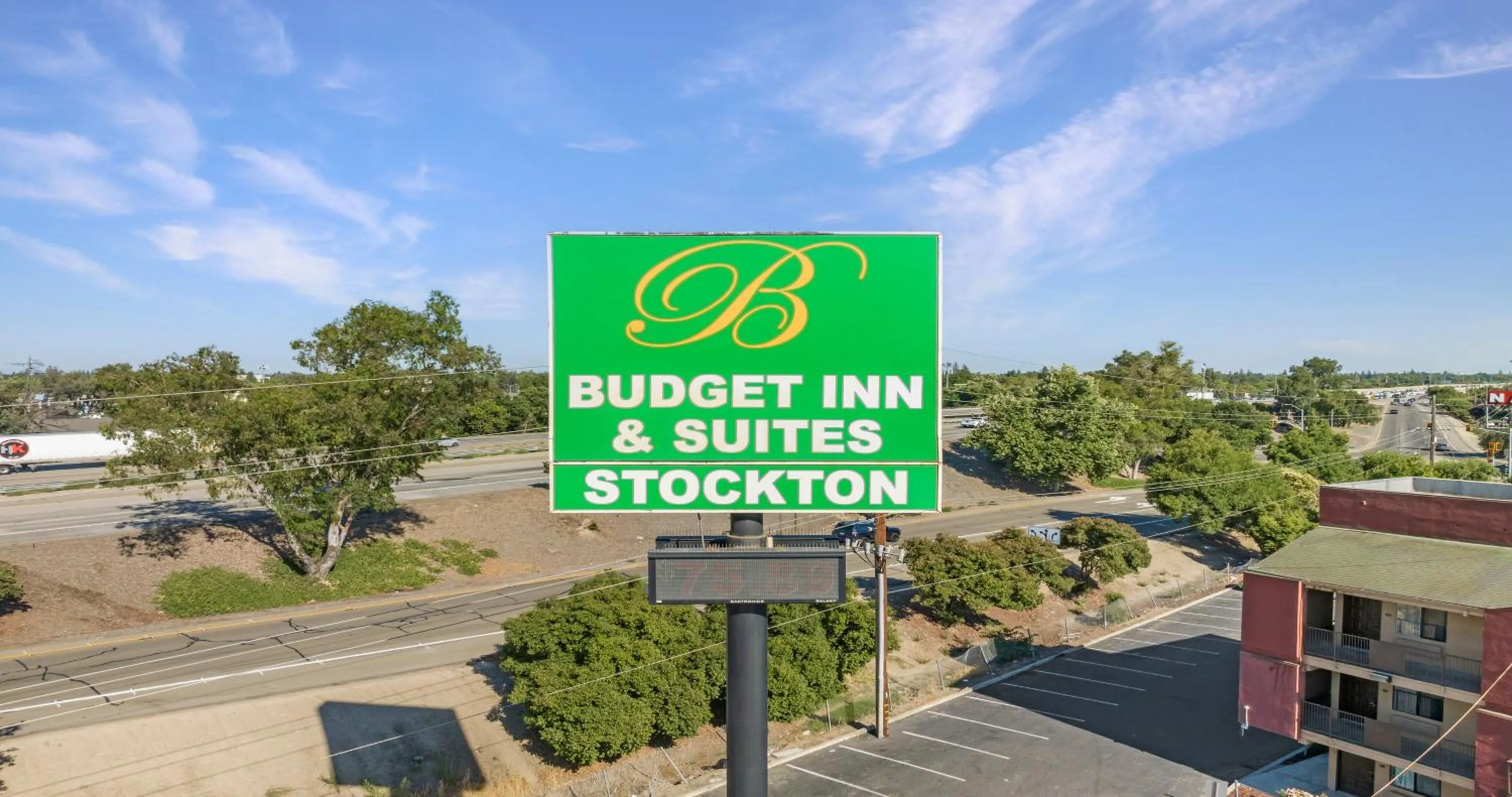 Property logo or sign in Budget Inn and Suites Stockton Yosemite