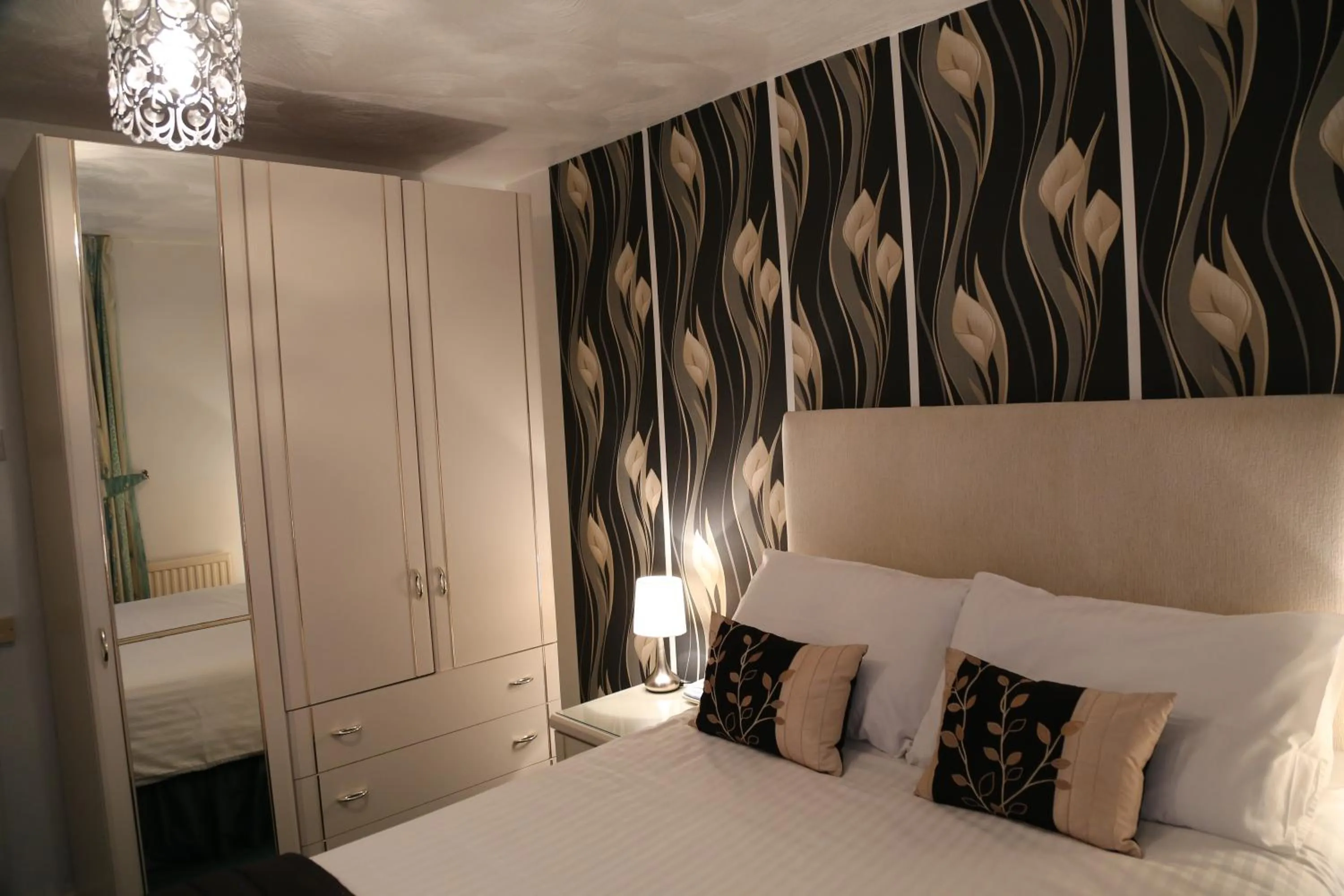 Bed in La Suisse Serviced Apartments