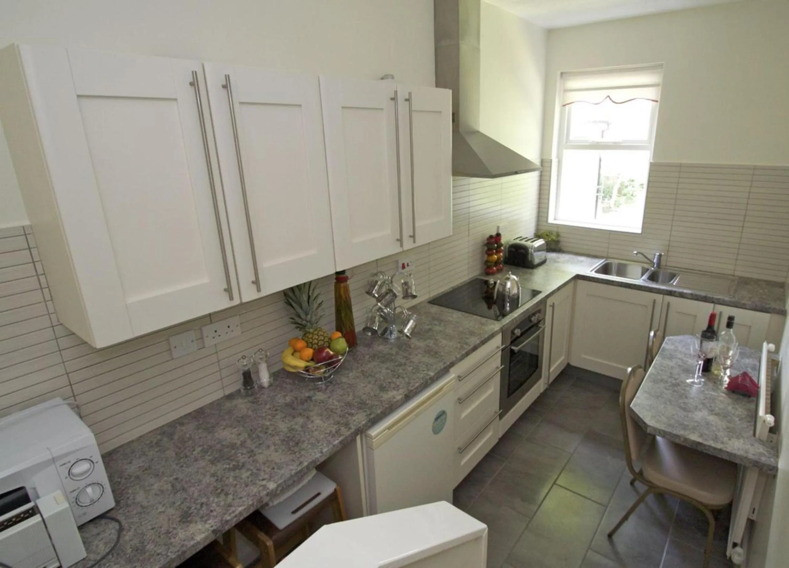 Kitchen or kitchenette in La Suisse Serviced Apartments