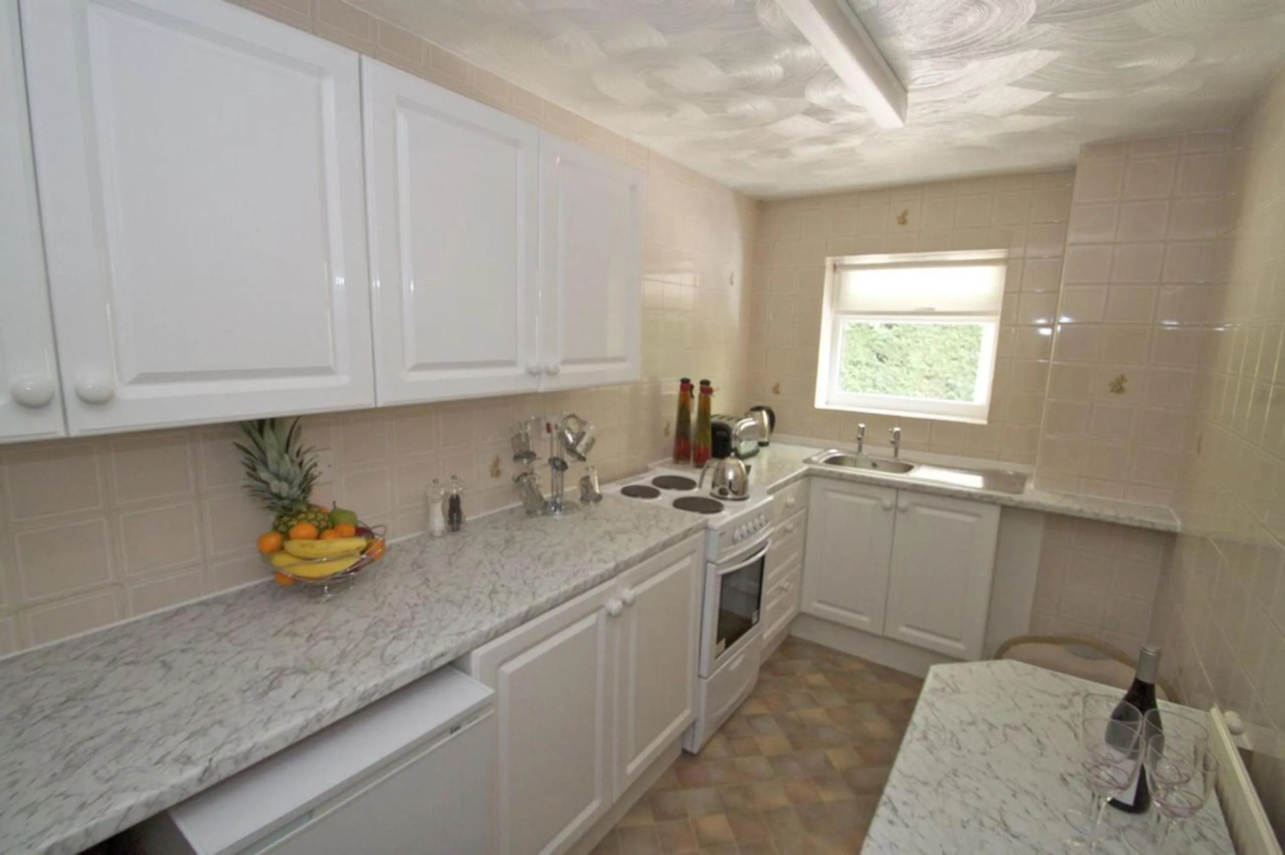 Kitchen or kitchenette in La Suisse Serviced Apartments