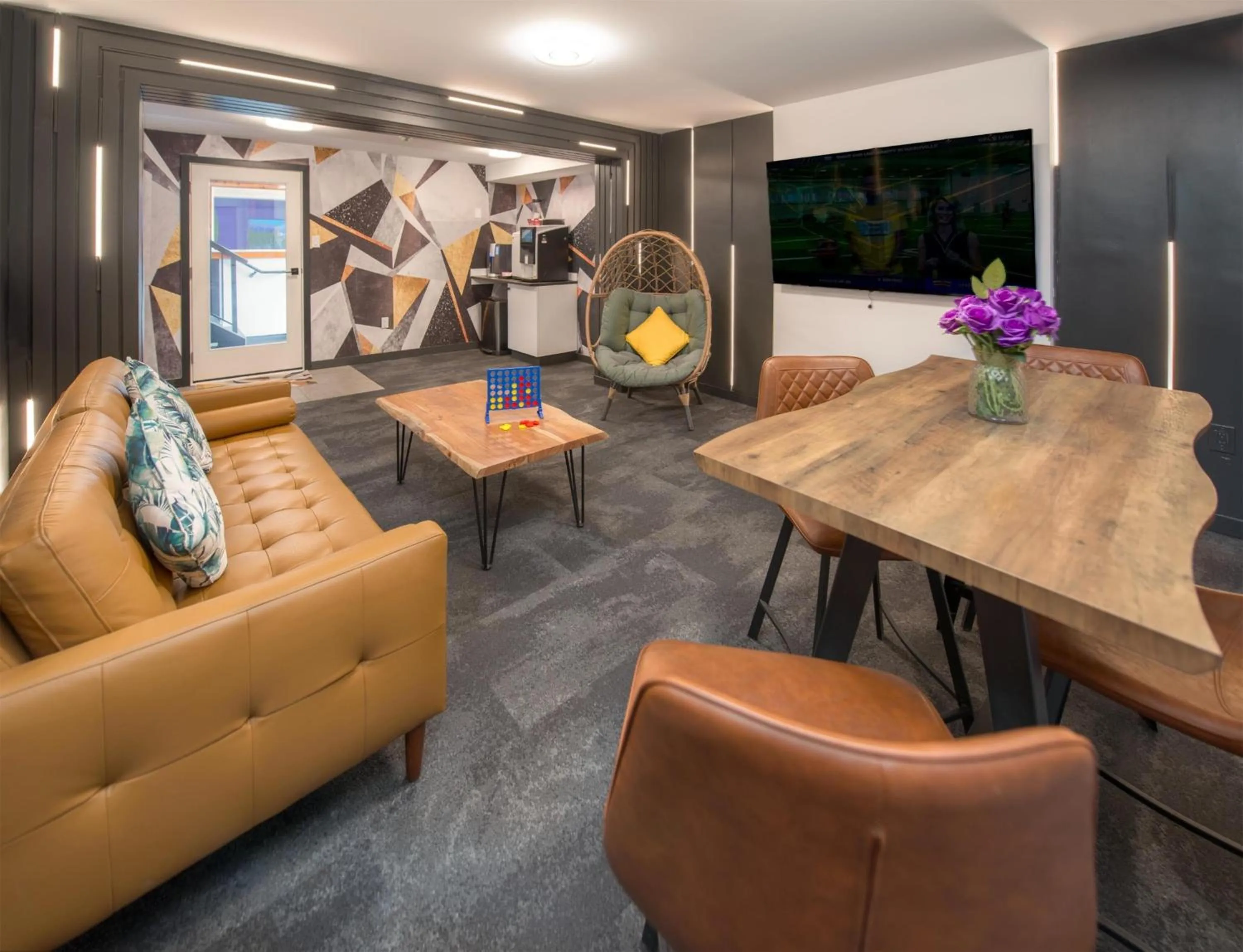 Communal lounge/ TV room in Coast Metro Vancouver Hotel