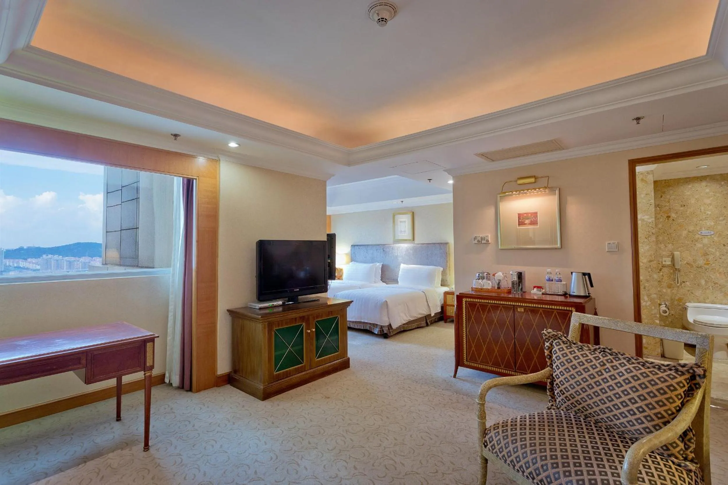 Living room, Bed in Crowne Plaza Qingdao by IHG