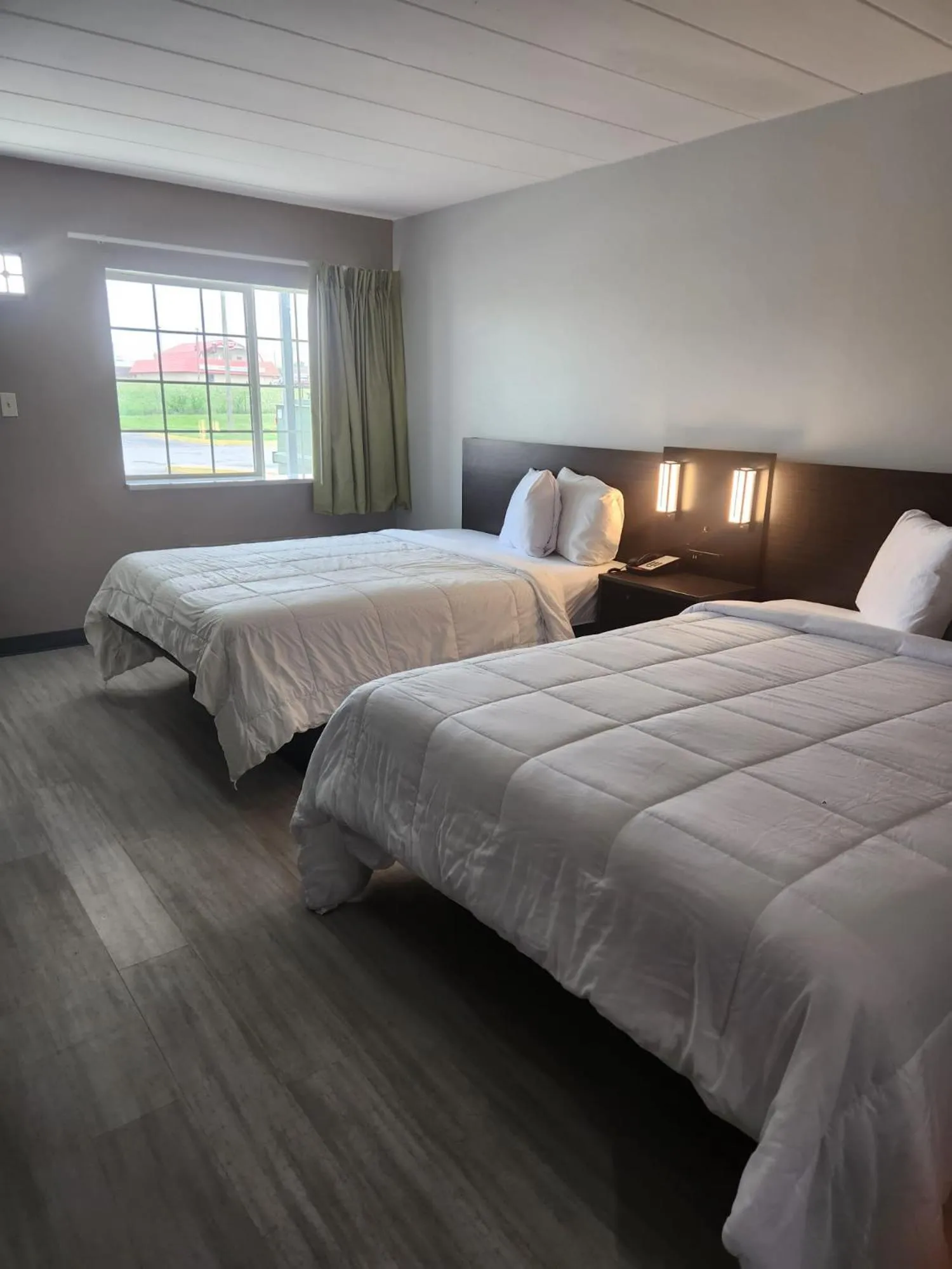 Bed in Royal Inn Hotel