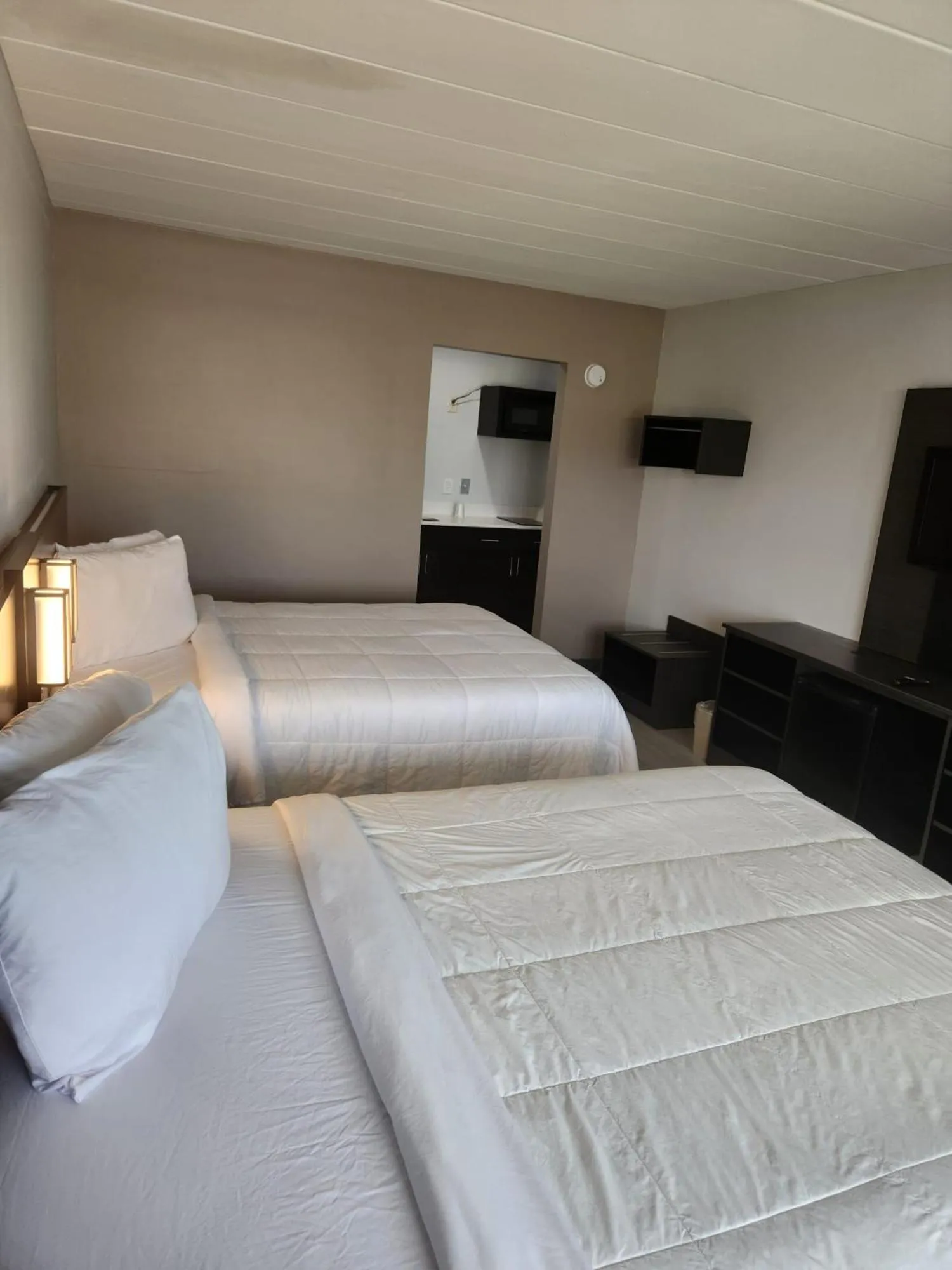 Bed in Royal Inn Hotel