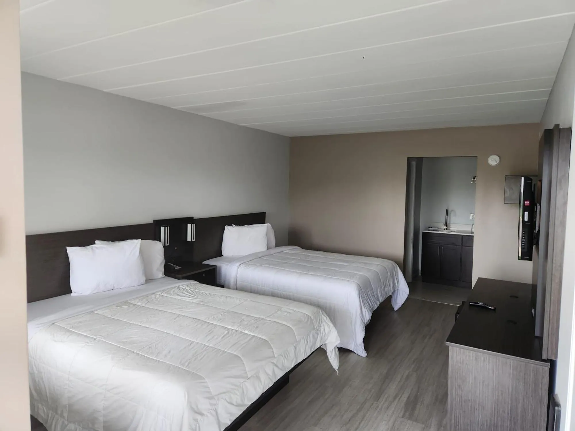 Bed in Royal Inn Hotel