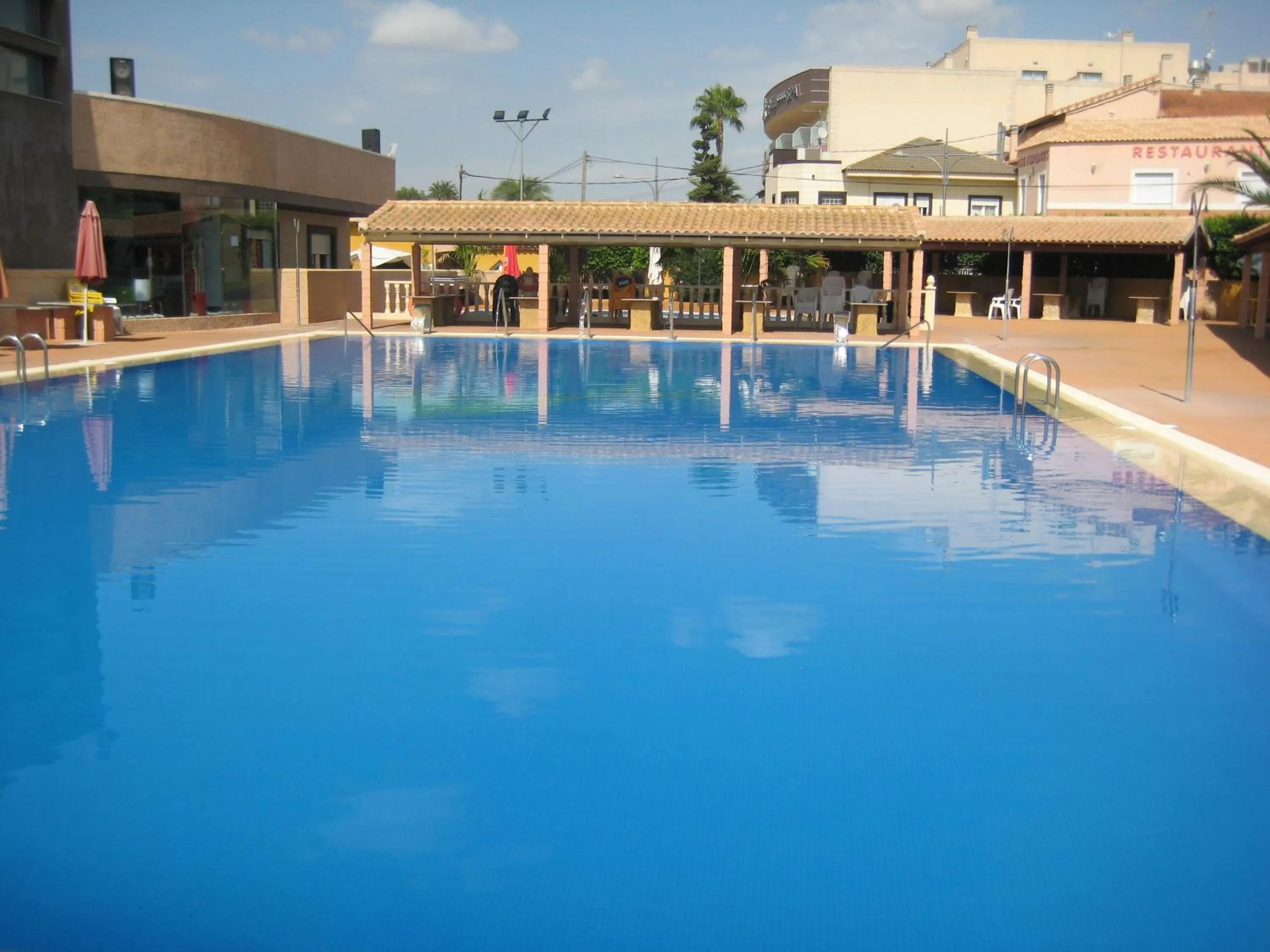 Swimming pool in Hospedium Hotel Los Periquitos