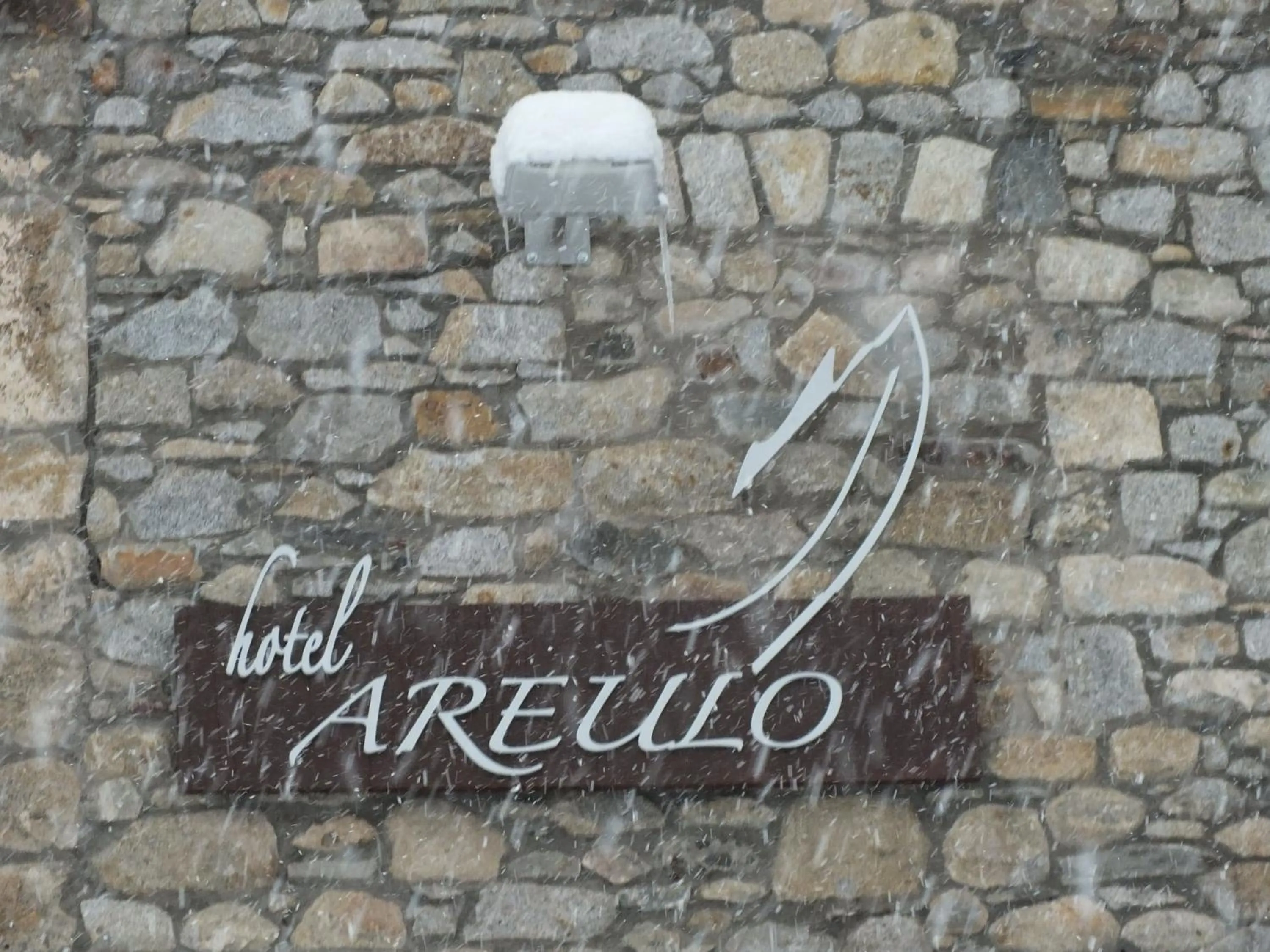 Property logo or sign in Hotel Areulo