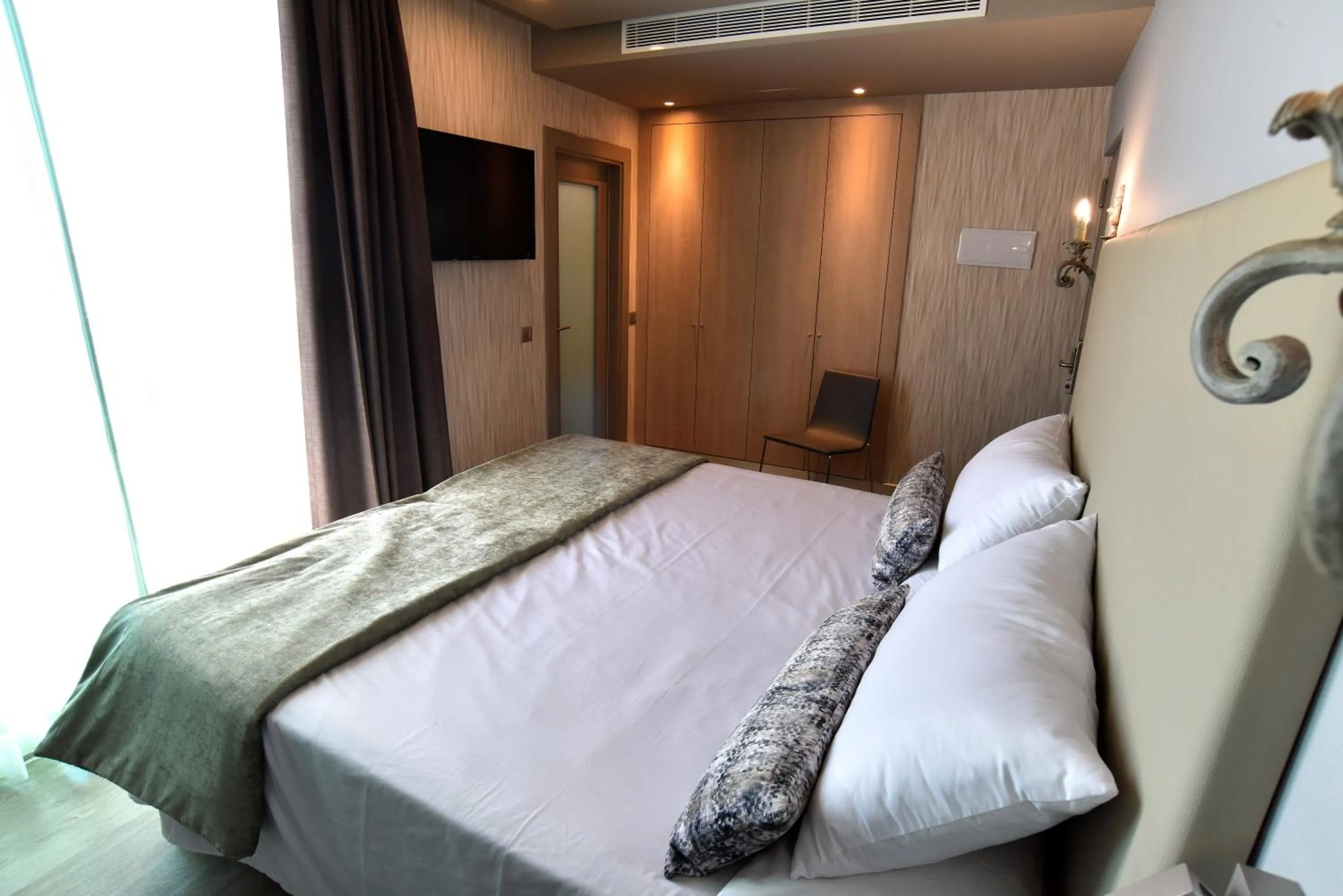 Bed in TC Hotel Doña Luisa