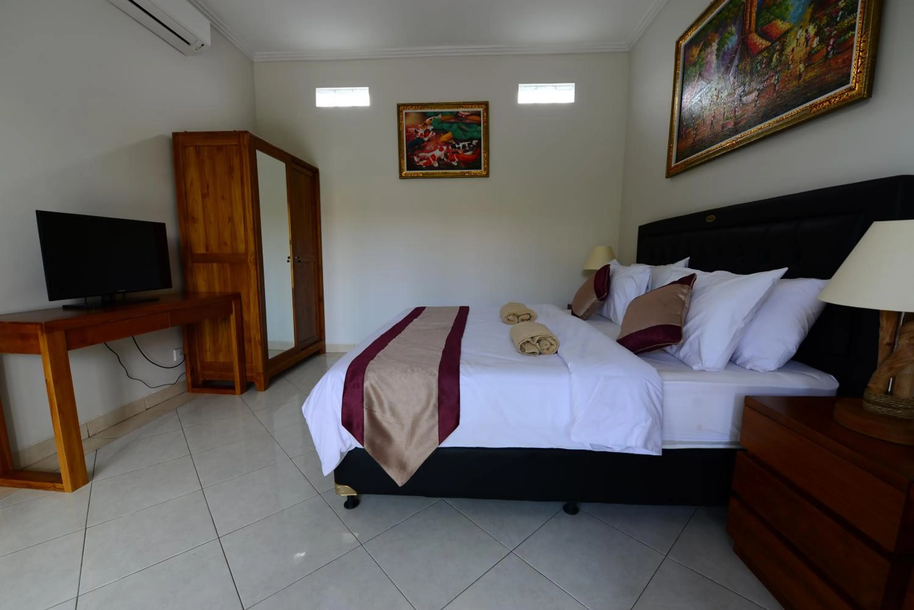 Bed in Surya Guest House Sanur