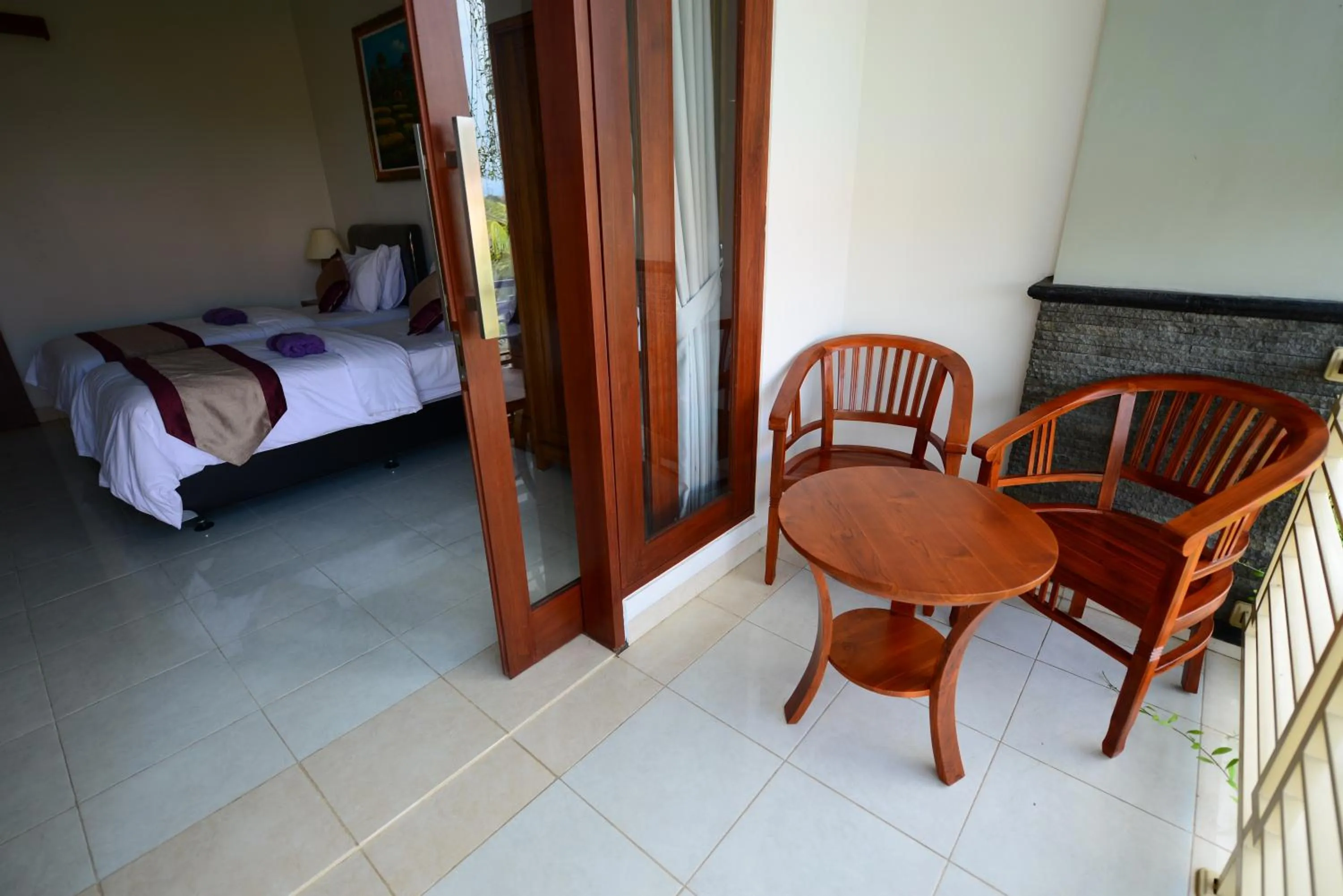 Bed in Surya Guest House Sanur