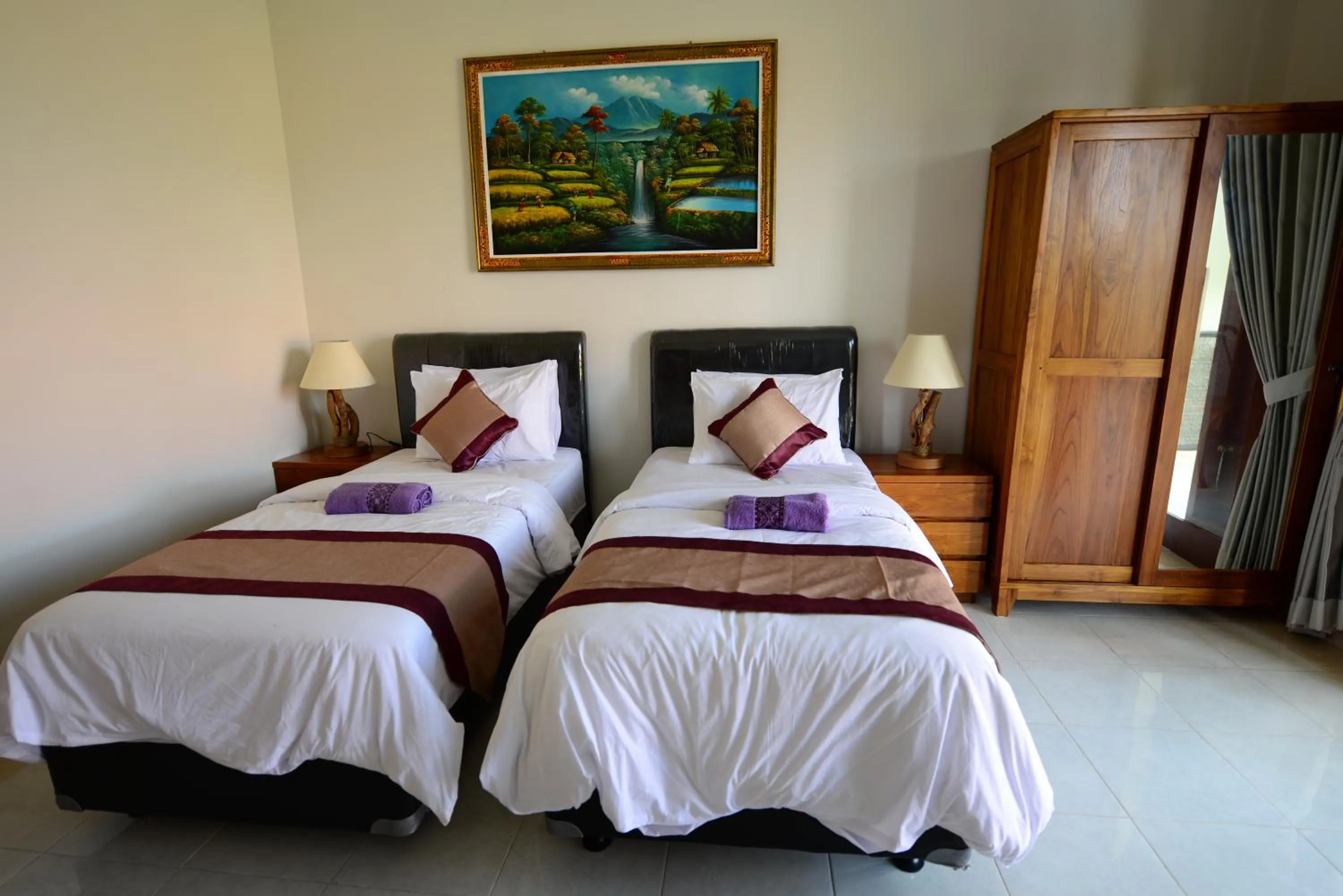 Bed in Surya Guest House Sanur