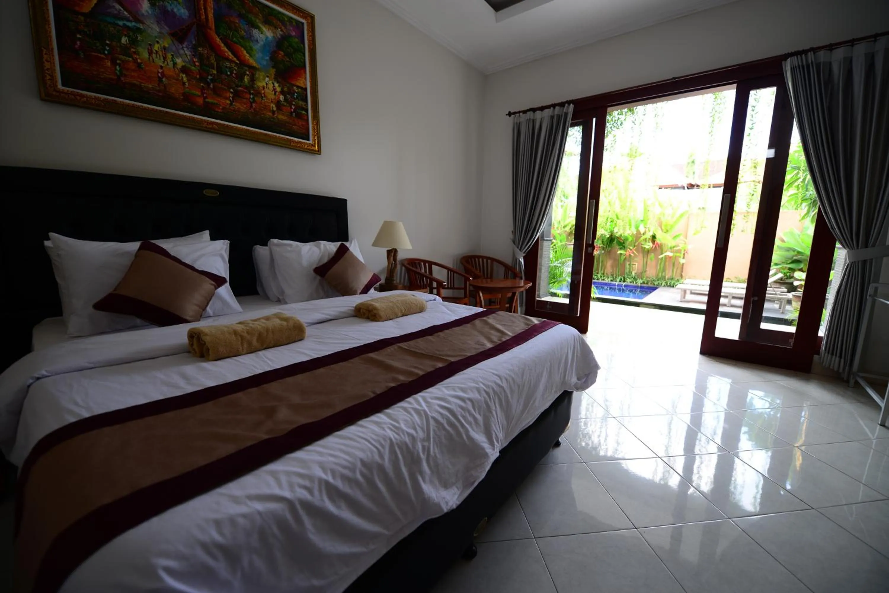 Bed in Surya Guest House Sanur
