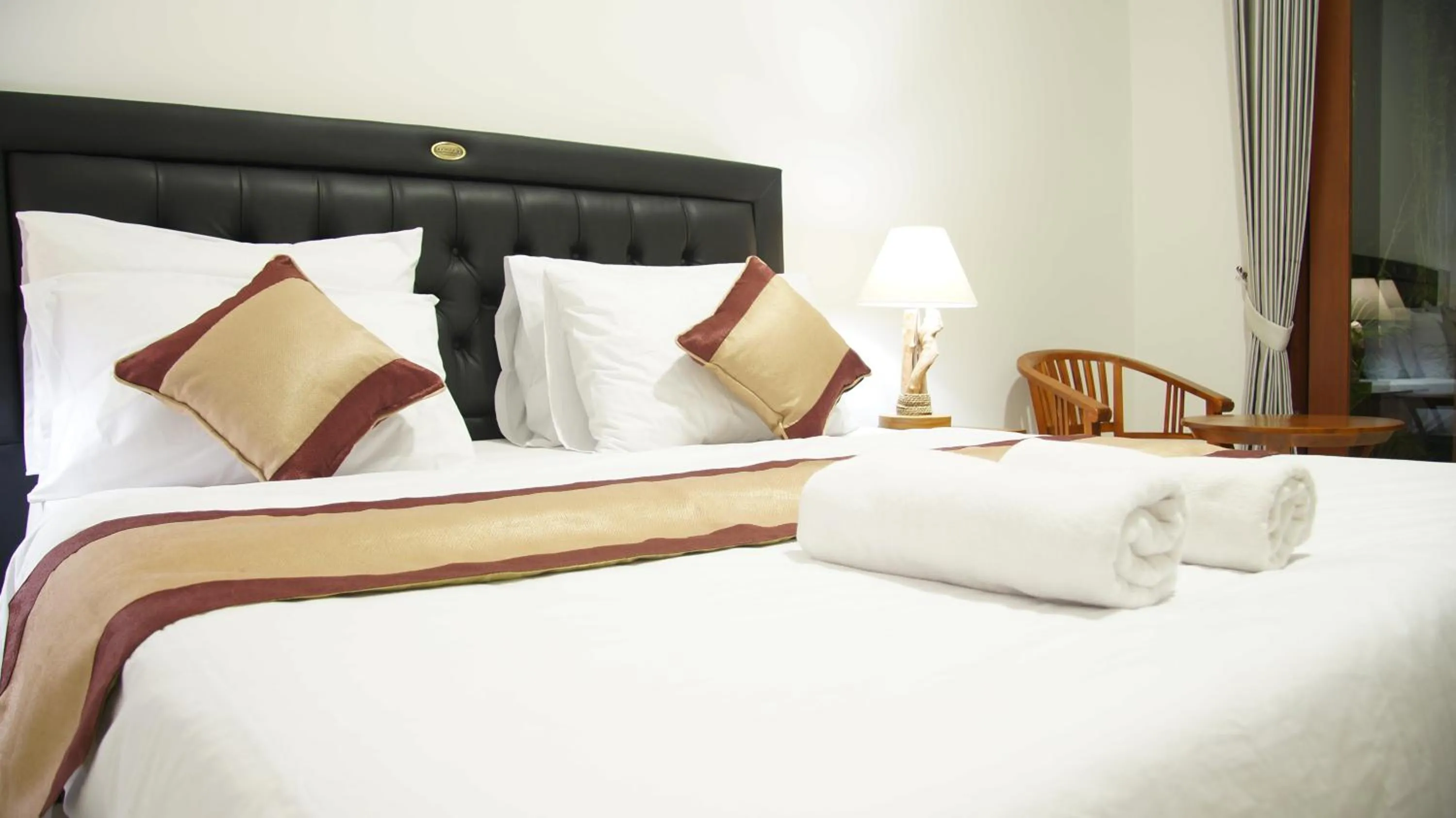 Bed in Surya Guest House Sanur