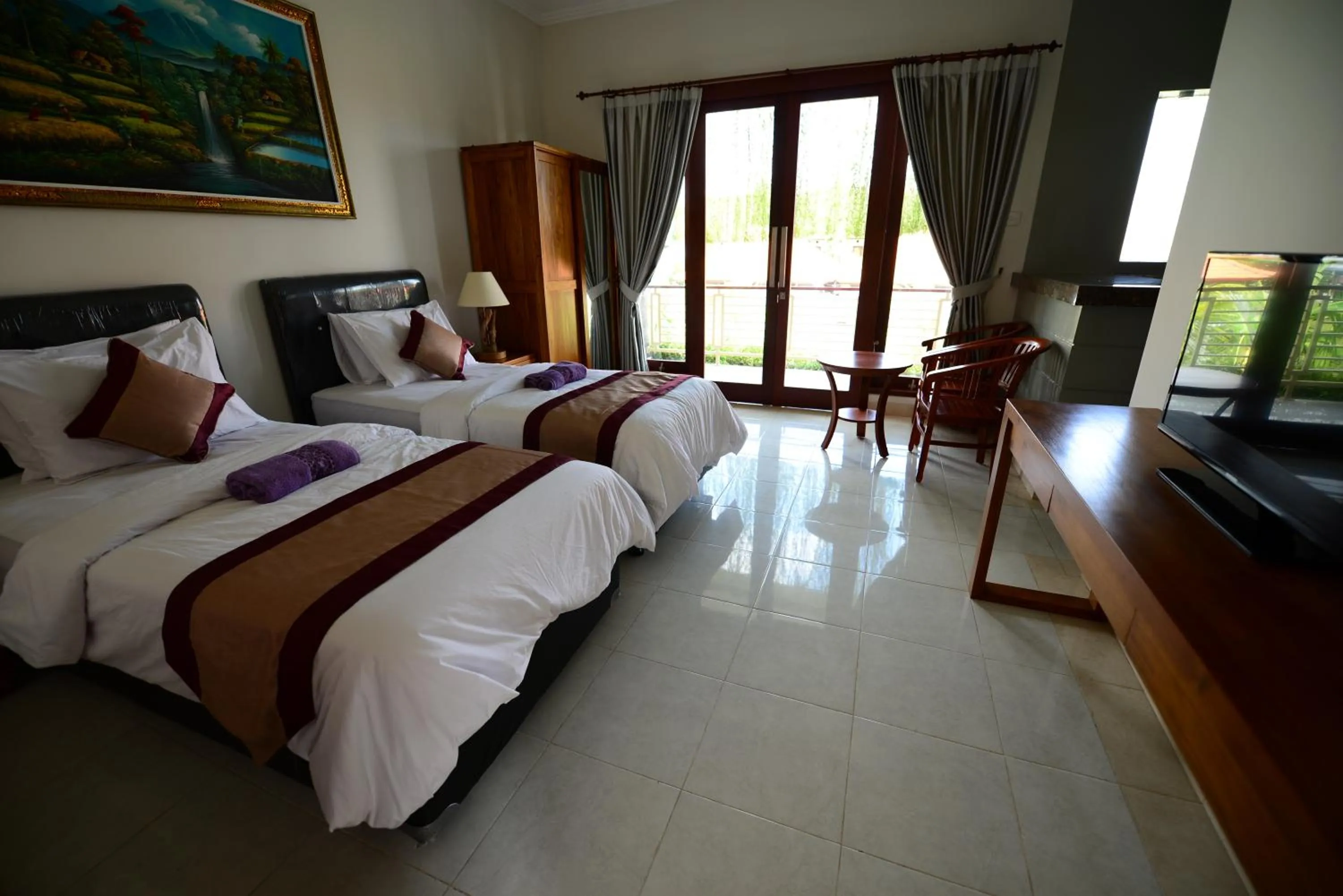 Bed in Surya Guest House Sanur