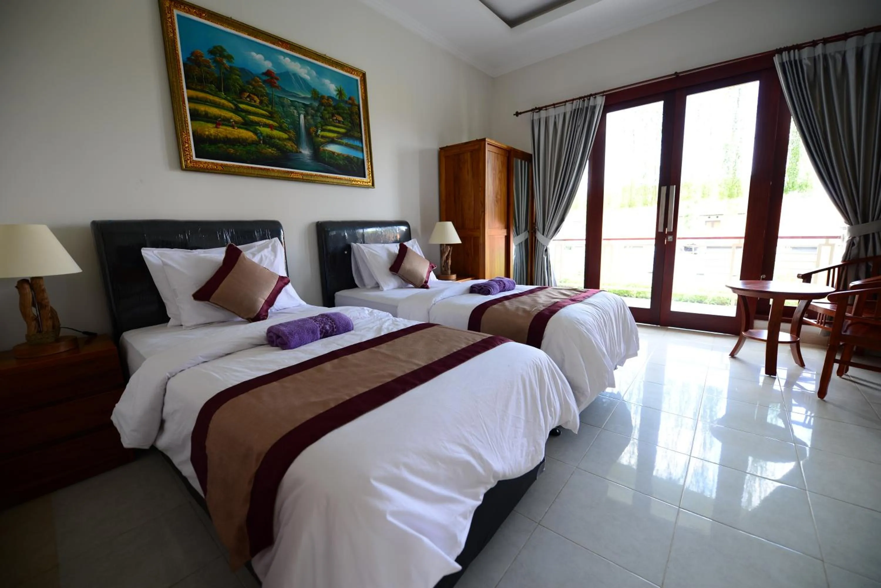 Bed in Surya Guest House Sanur