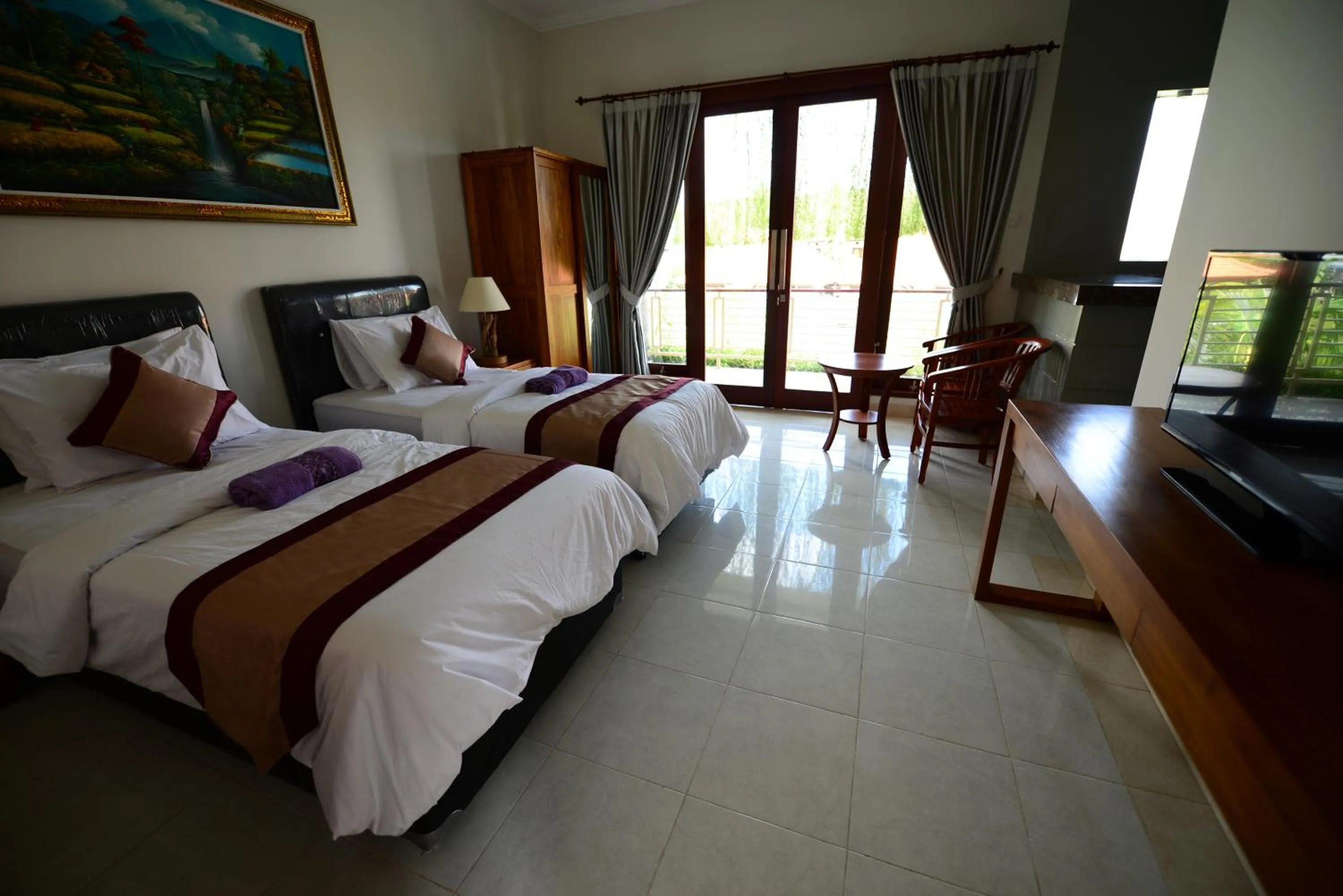 Bed in Surya Guest House Sanur
