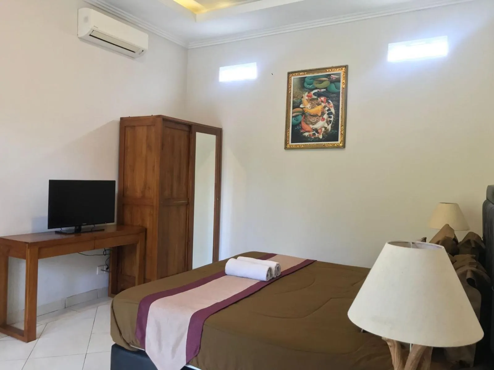 Bed in Surya Guest House Sanur