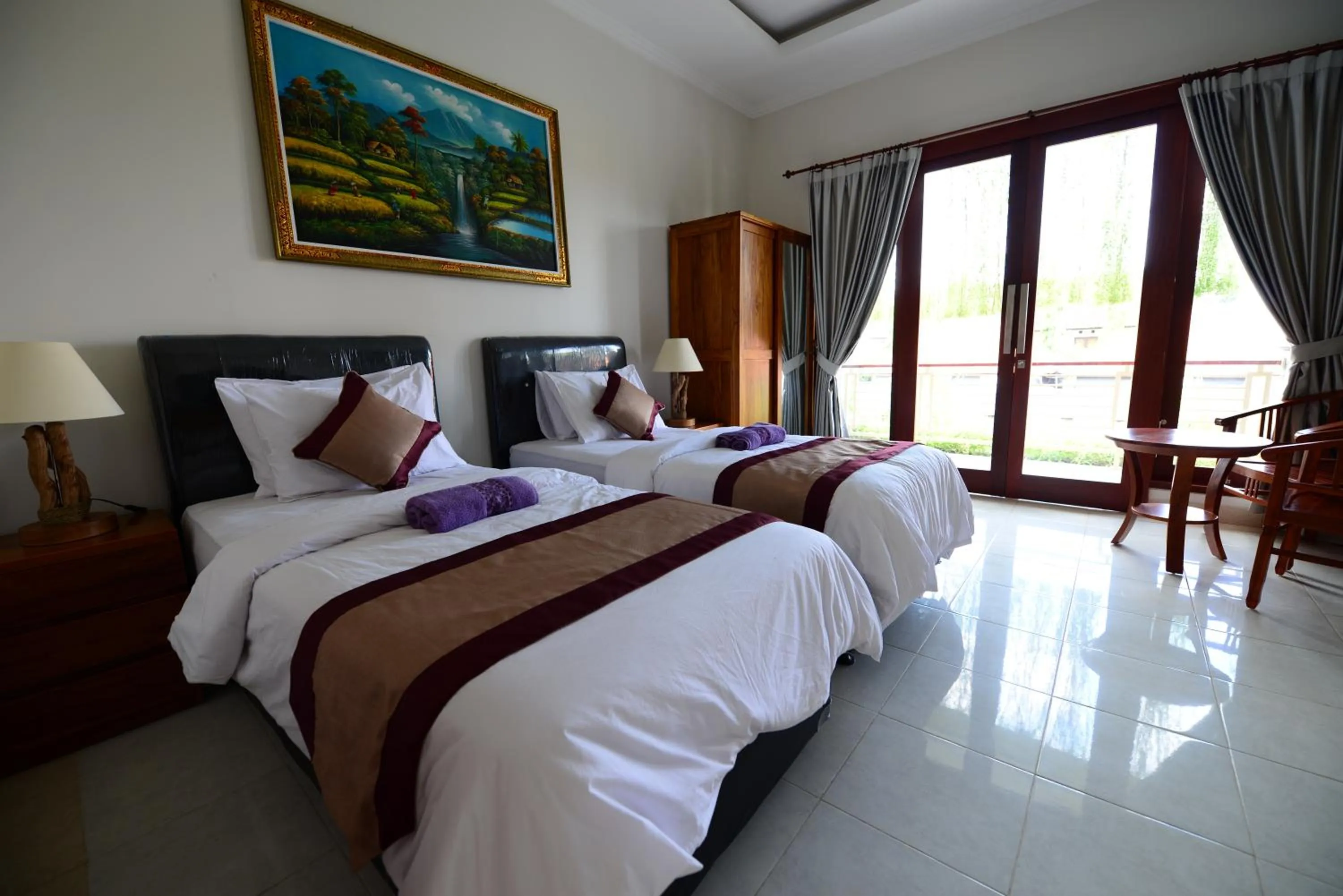 Bed in Surya Guest House Sanur