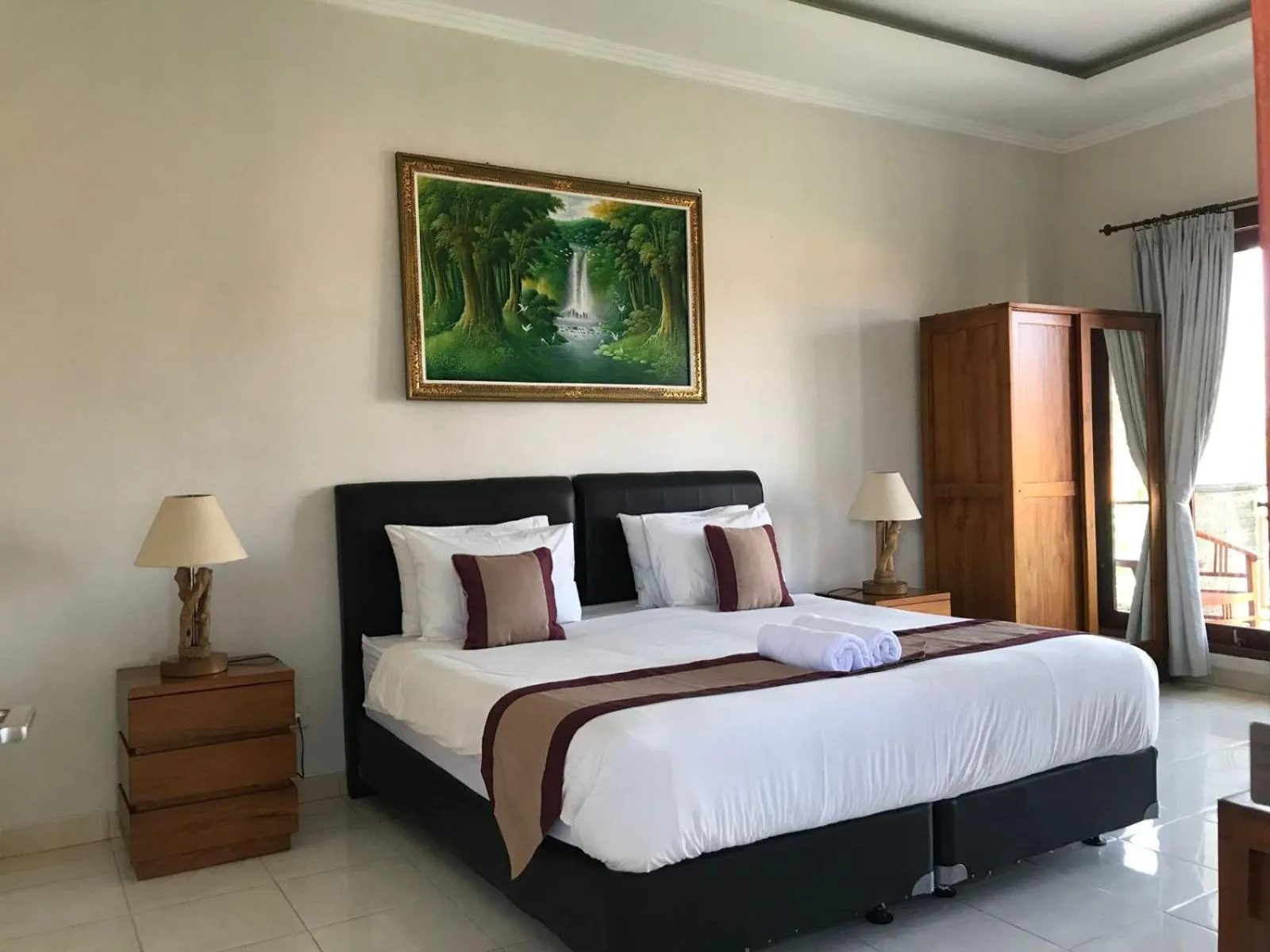 Bed in Surya Guest House Sanur