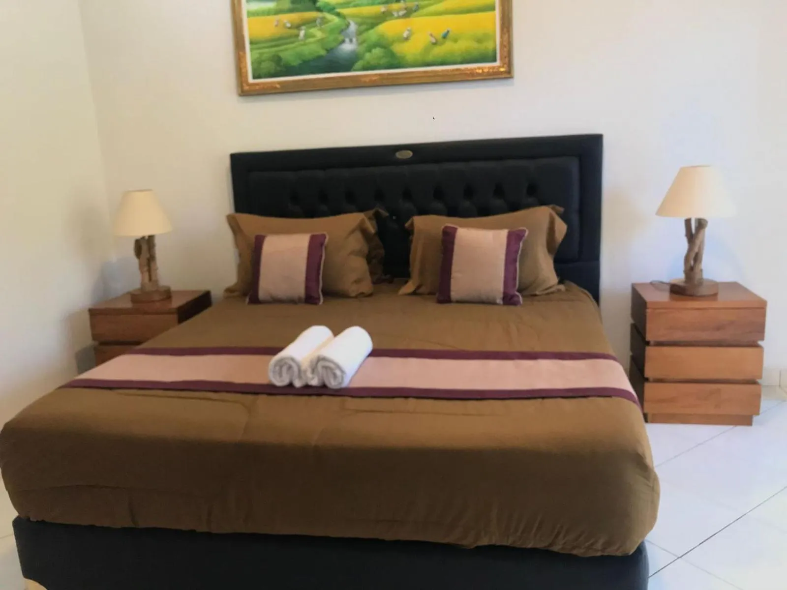 Bed in Surya Guest House Sanur