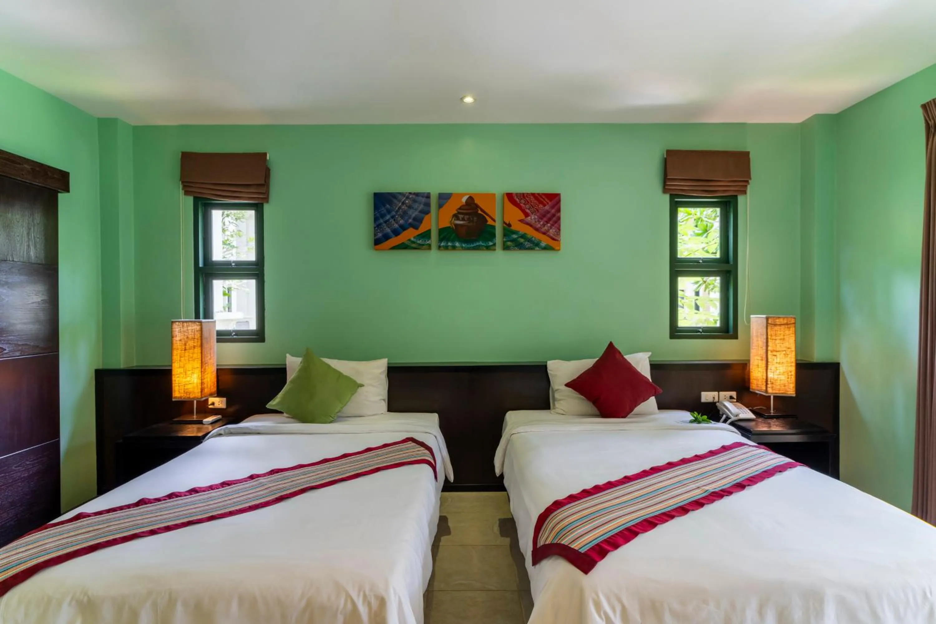 Bed in Baan Khaolak Beach Resort