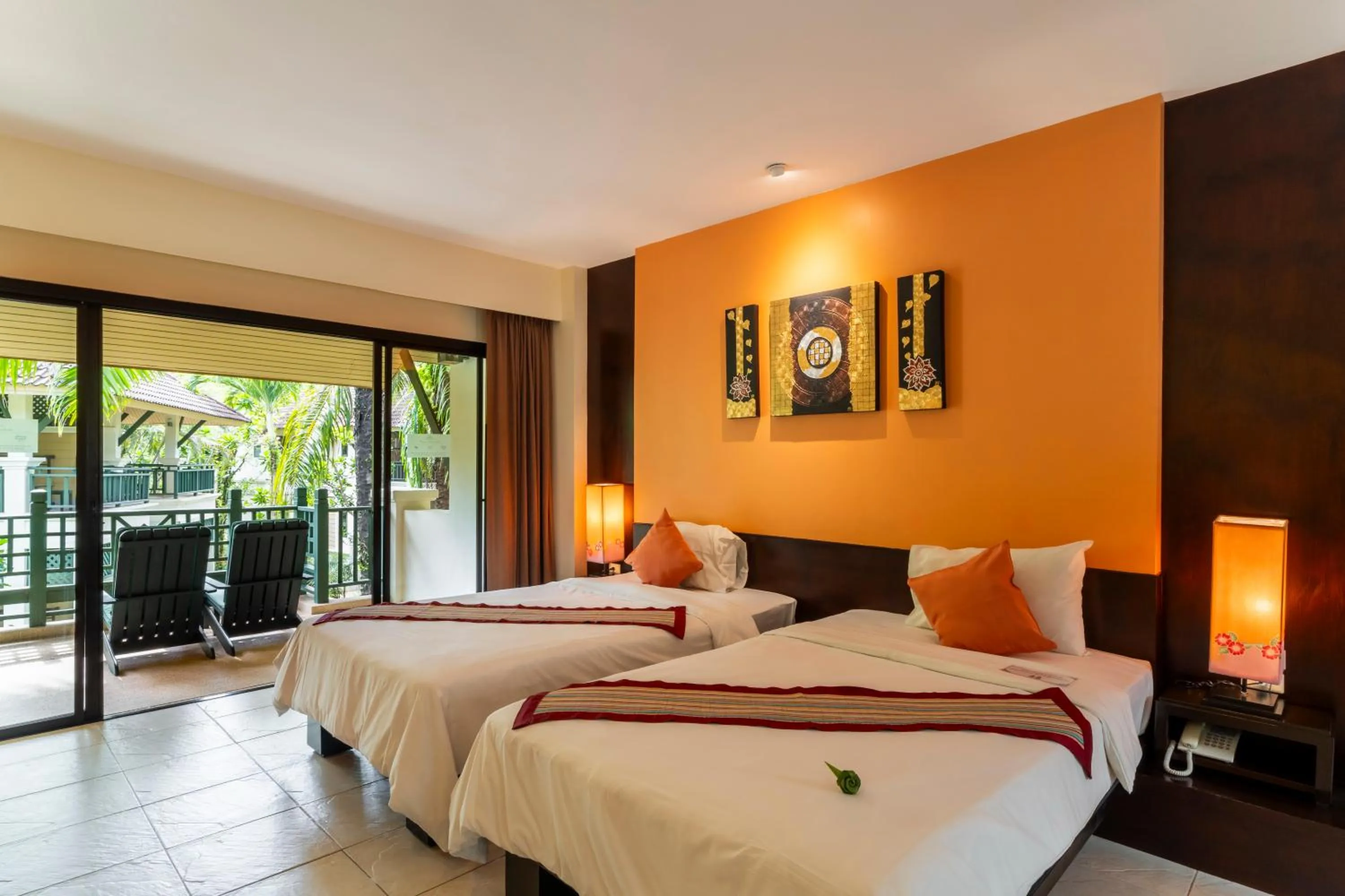 Bed in Baan Khaolak Beach Resort