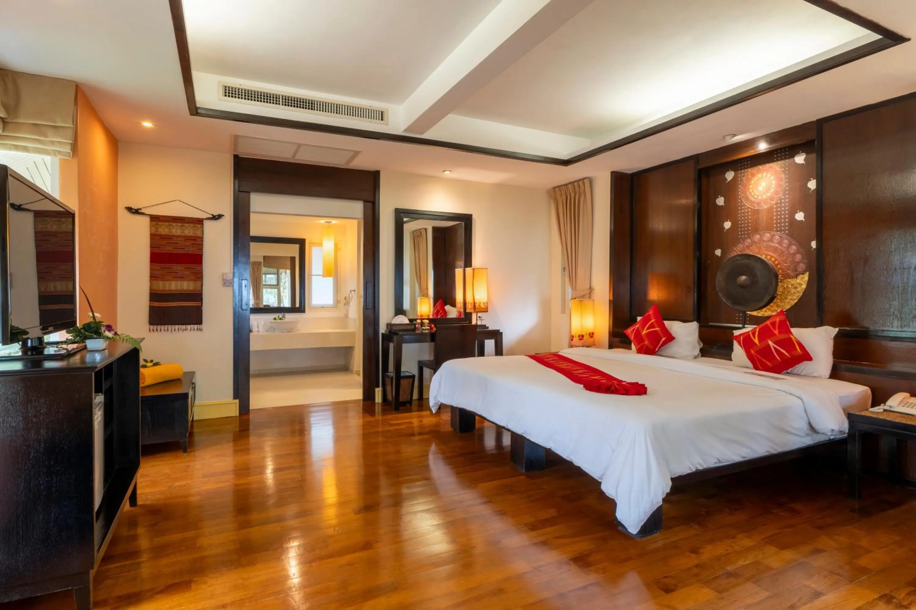 Bed in Baan Khaolak Beach Resort