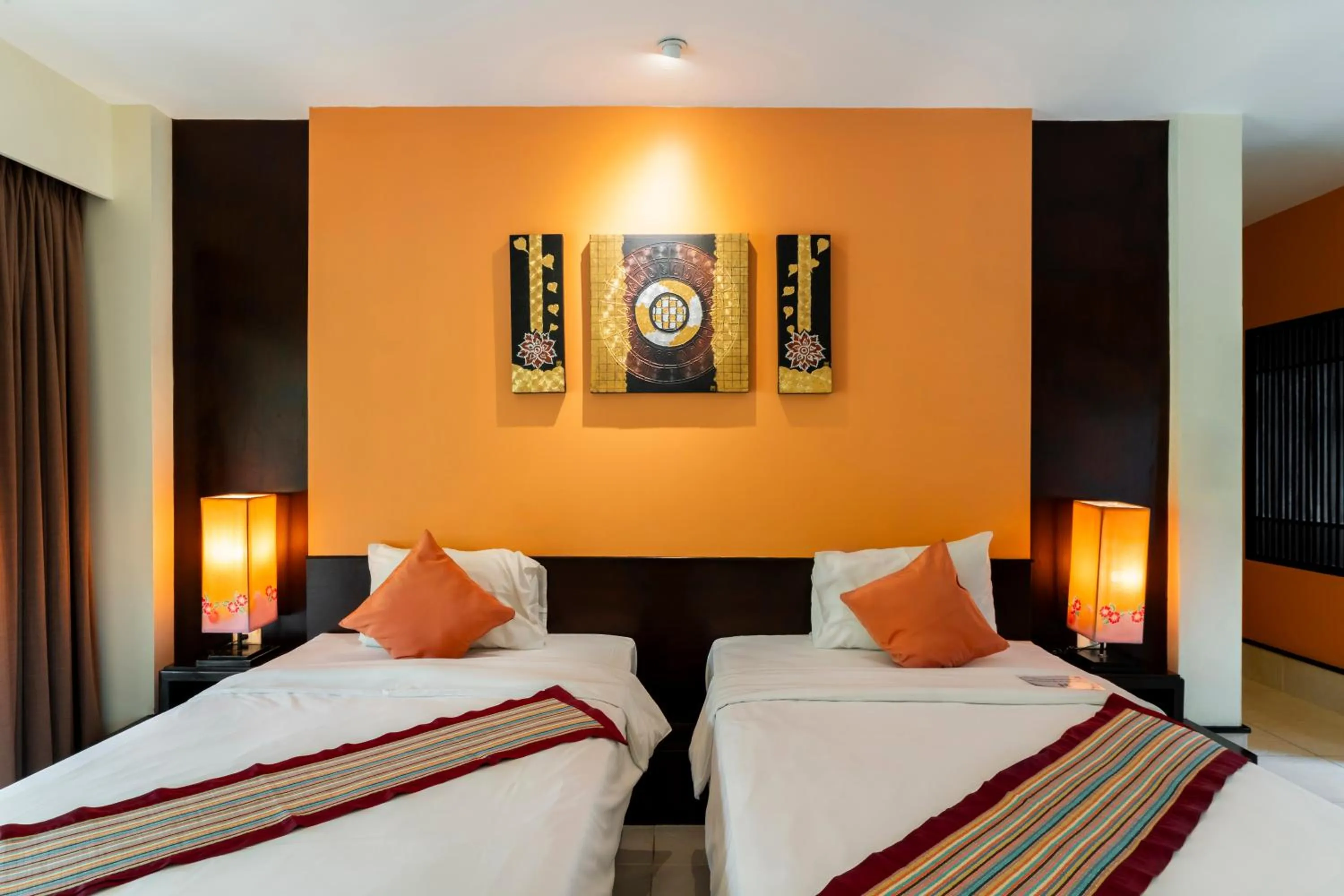 Bed in Baan Khaolak Beach Resort